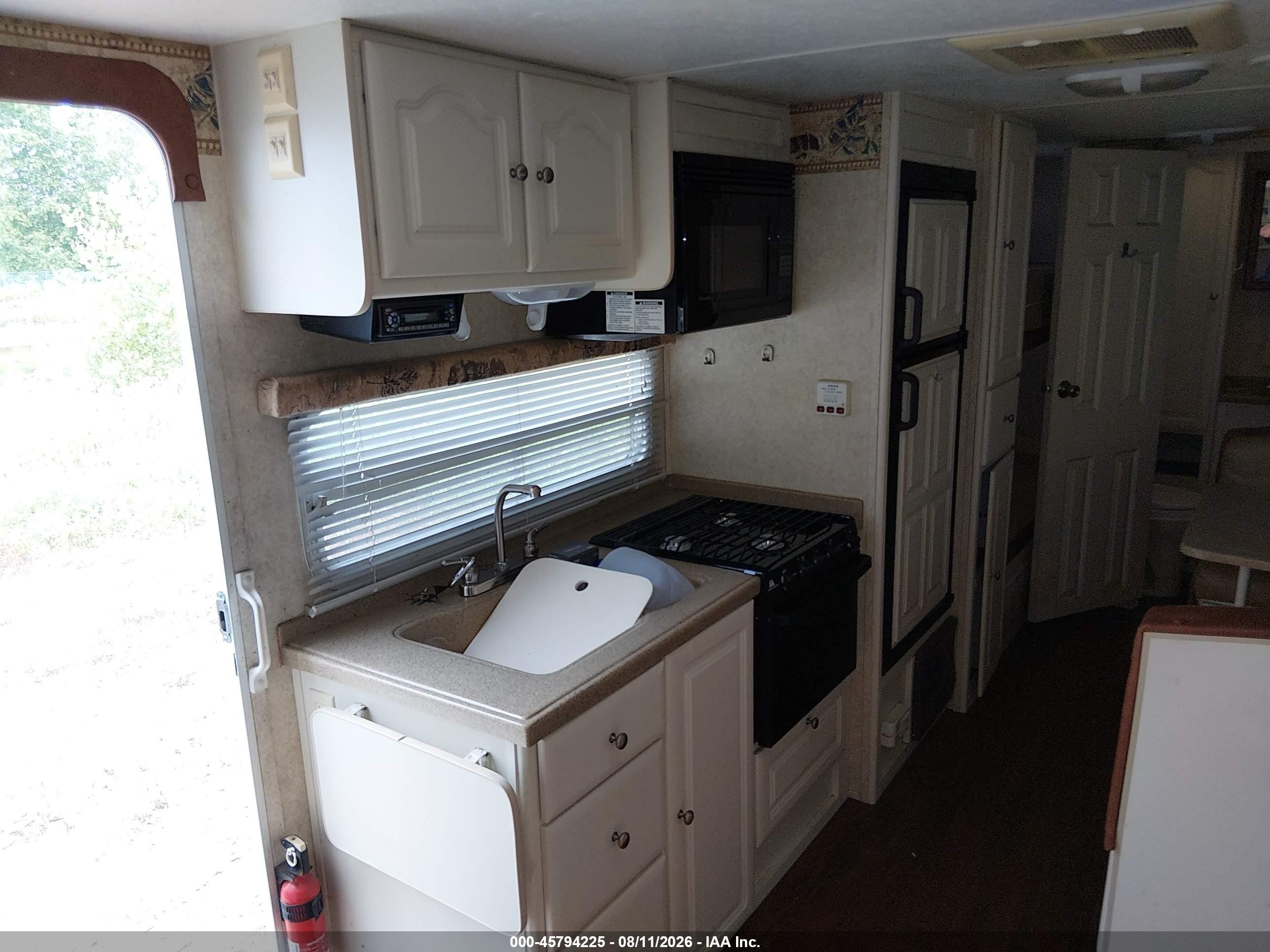2005 Keystone Rv Outback VIN 4YDT28B245G912274 IAAI salvage auction — Top/Roof, Clear (Wisconsin), sold $25 on 2026-09-16 (photo 7)