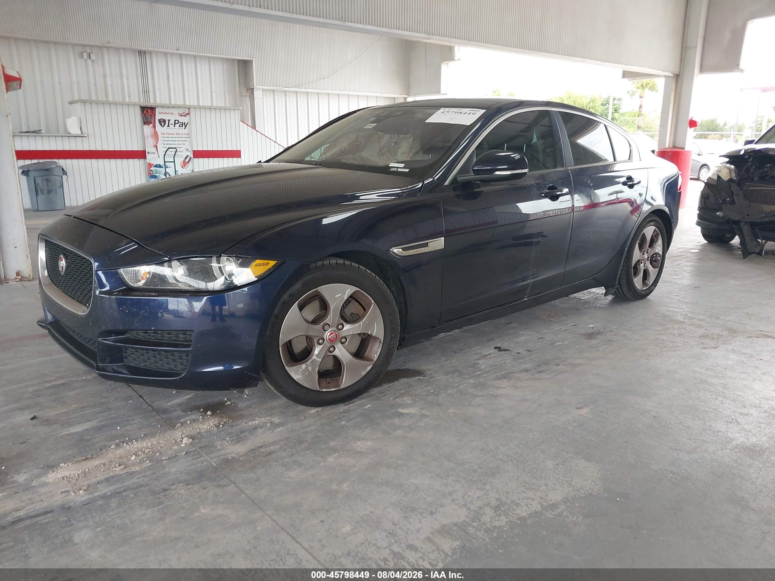 2018 Jaguar Xe VIN SAJAR4FX1JCP34833 IAAI salvage auction — Side, Rebuildable (Florida), sold $650 on 2026-09-09 (photo 2)
