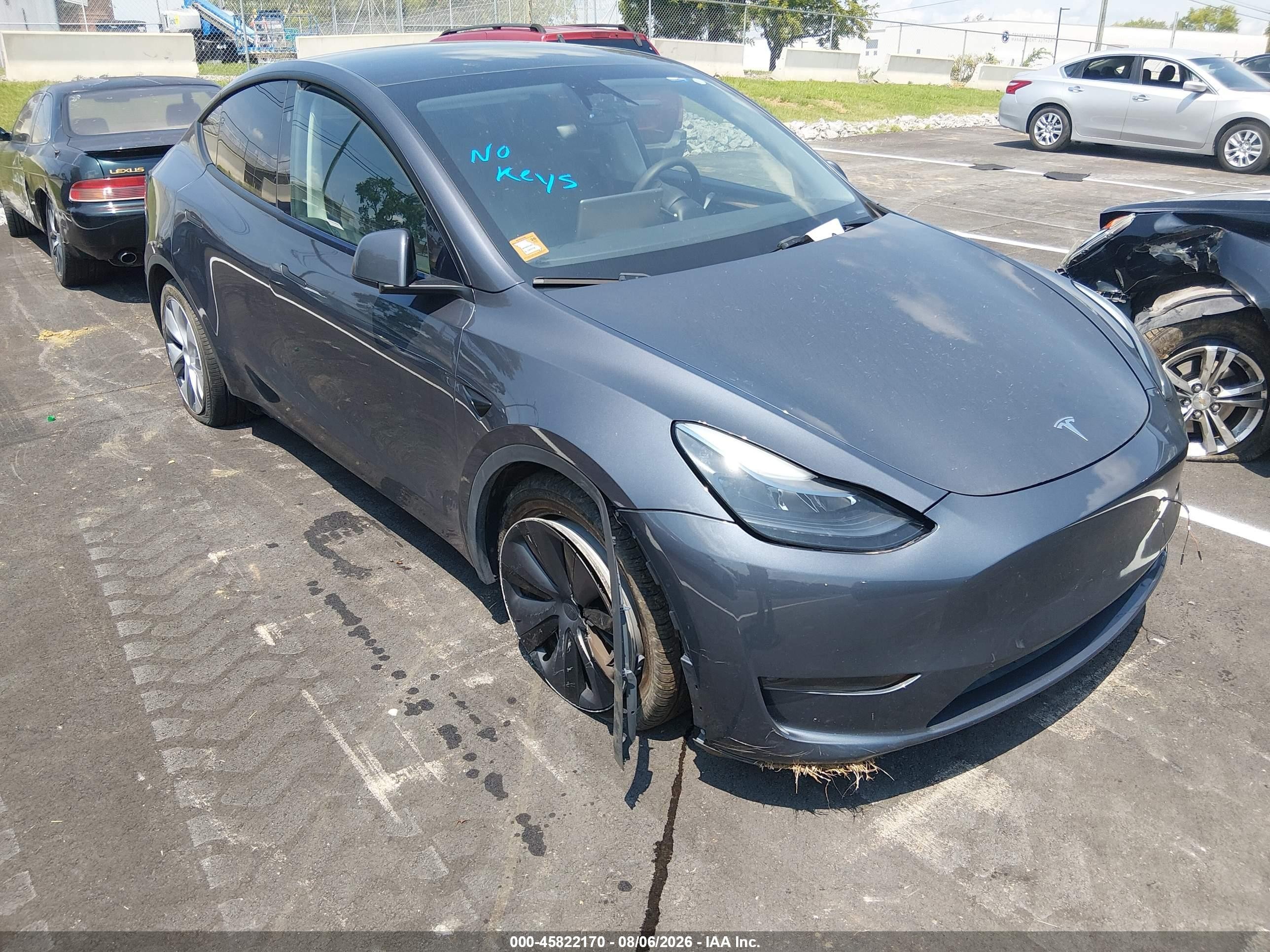2023 Tesla Model Y VIN 7SAYGDED7PF948122 IAAI salvage auction — Side, Salvage (Tennessee), sold $8,600 on 2026-09-12 (photo 1)