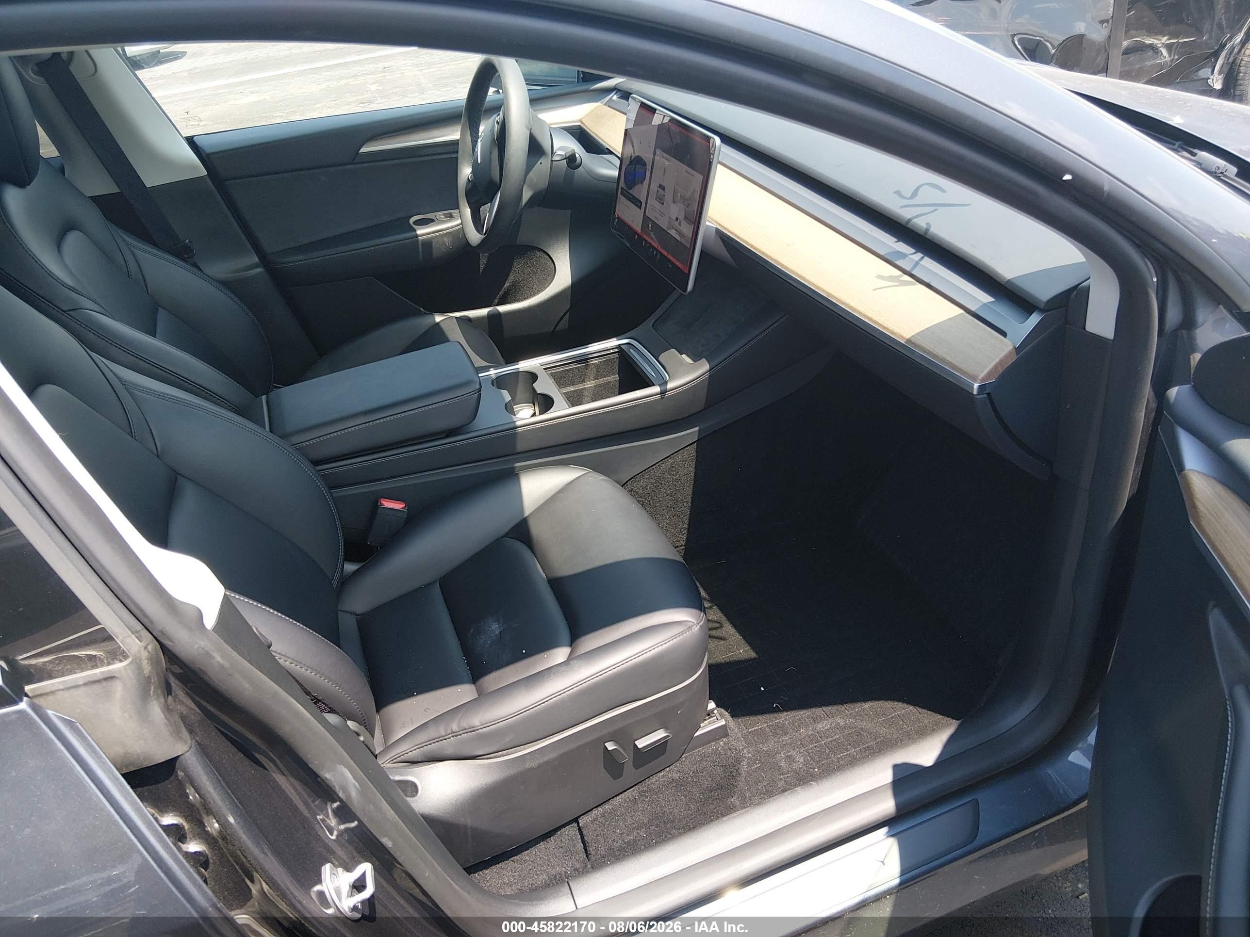 2023 Tesla Model Y VIN 7SAYGDED7PF948122 IAAI salvage auction — Side, Salvage (Tennessee), sold $8,600 on 2026-09-12 (photo 5)