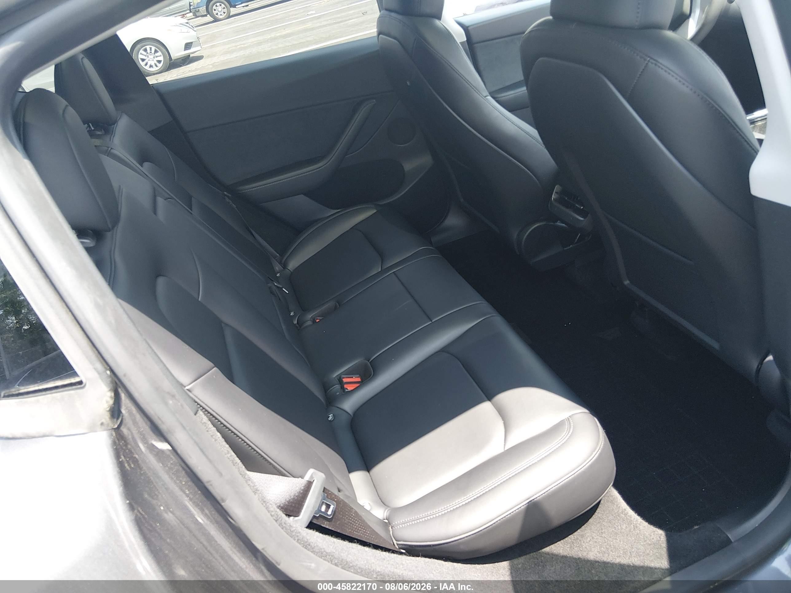 2023 Tesla Model Y VIN 7SAYGDED7PF948122 IAAI salvage auction — Side, Salvage (Tennessee), sold $8,600 on 2026-09-12 (photo 8)