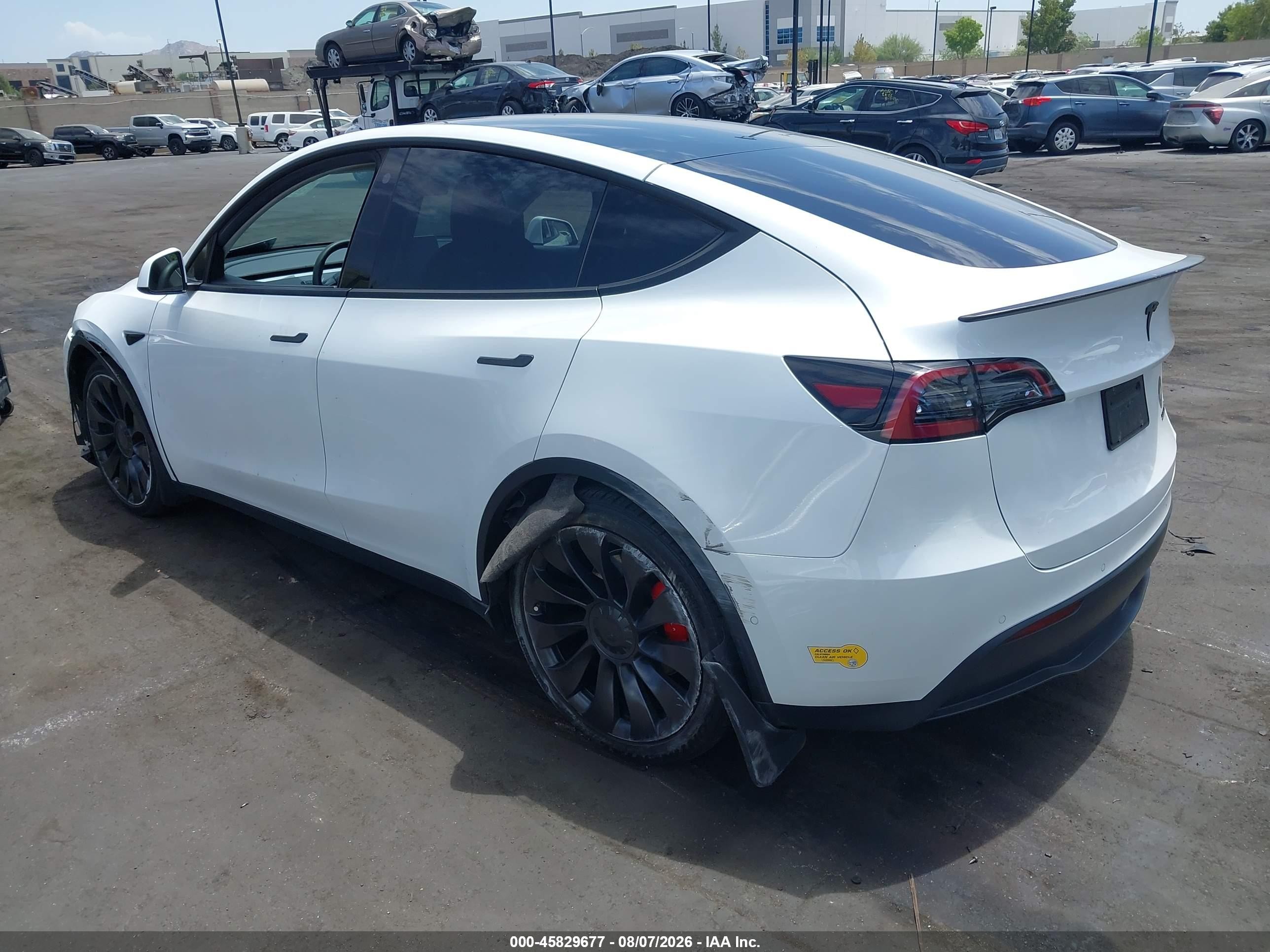 2022 Tesla Model Y VIN 7SAYGDEF6NF404628 IAAI salvage auction — Side, Salvage Certificate (California), sold $9,400 on 2026-09-13 (photo 3)