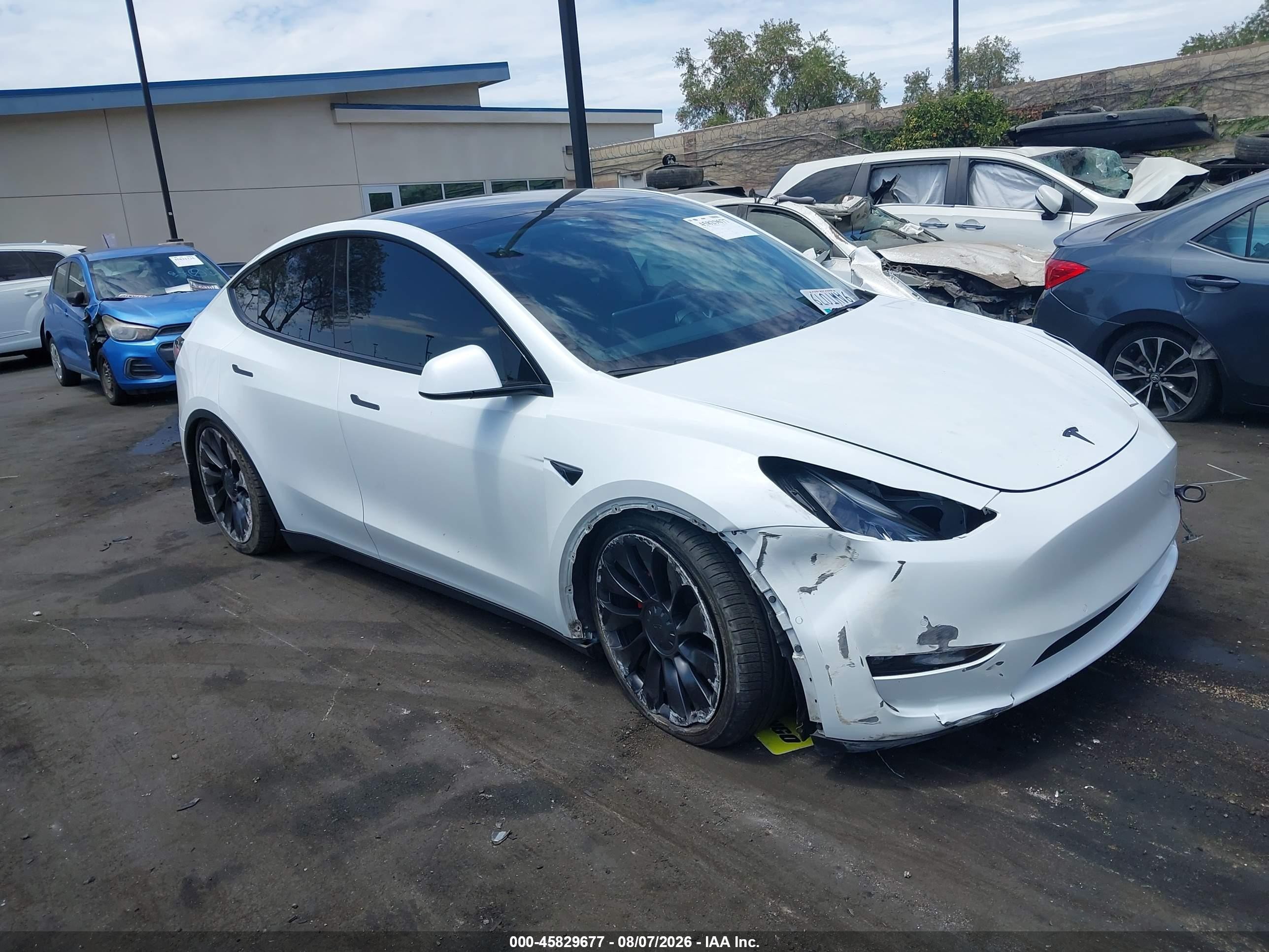2022 Tesla Model Y VIN 7SAYGDEF6NF404628 IAAI salvage auction — Side, Salvage Certificate (California), sold $9,400 on 2026-09-13 (photo 6)
