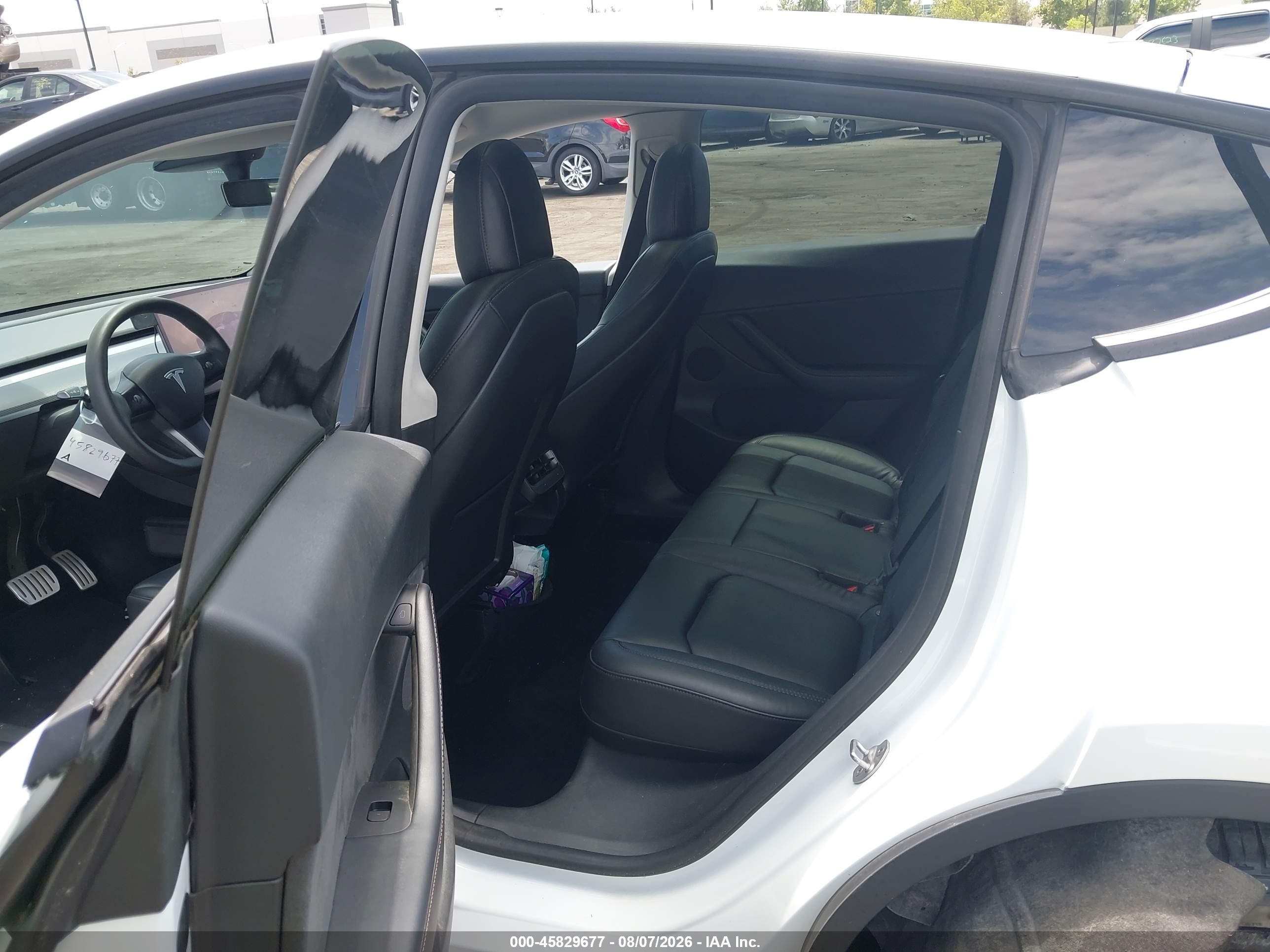 2022 Tesla Model Y VIN 7SAYGDEF6NF404628 IAAI salvage auction — Side, Salvage Certificate (California), sold $9,400 on 2026-09-13 (photo 8)