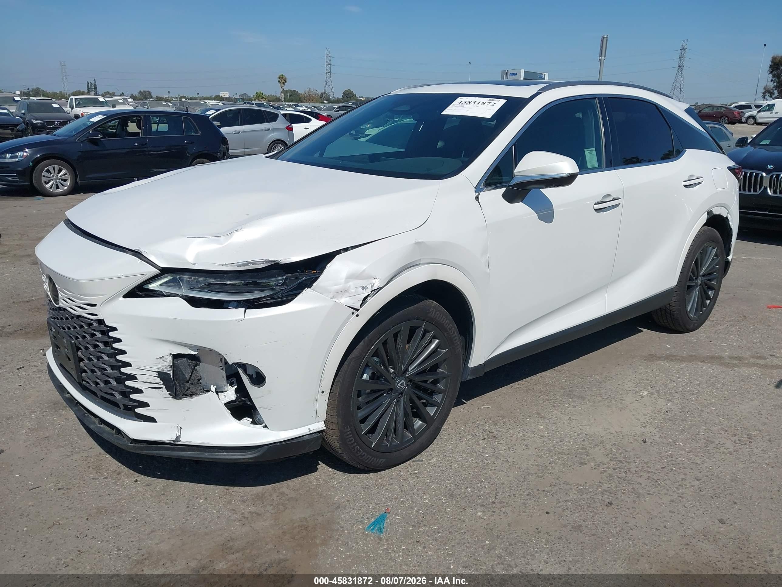 2026 Lexus Rx VIN 2T2BBMCA8TC108984 IAAI salvage auction — Front & Rear, Salvage (California), sold $19,700 on 2026-08-20 (photo 2)