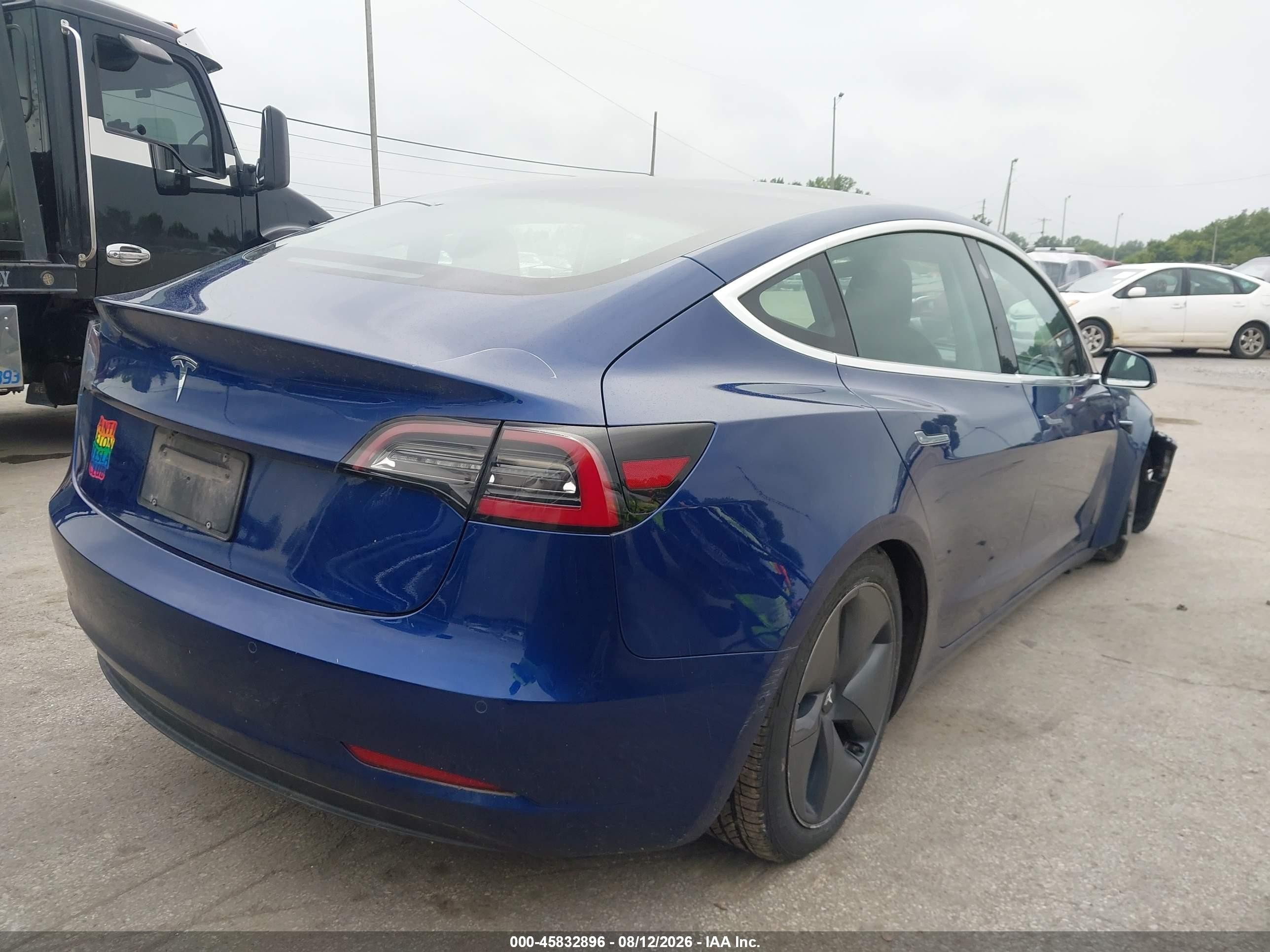 2020 Tesla Model 3 VIN 5YJ3E1EAXLF736892 IAAI salvage auction — Unknown, Salvage (Ohio), sold $6,875 on 2026-10-02 (photo 4)