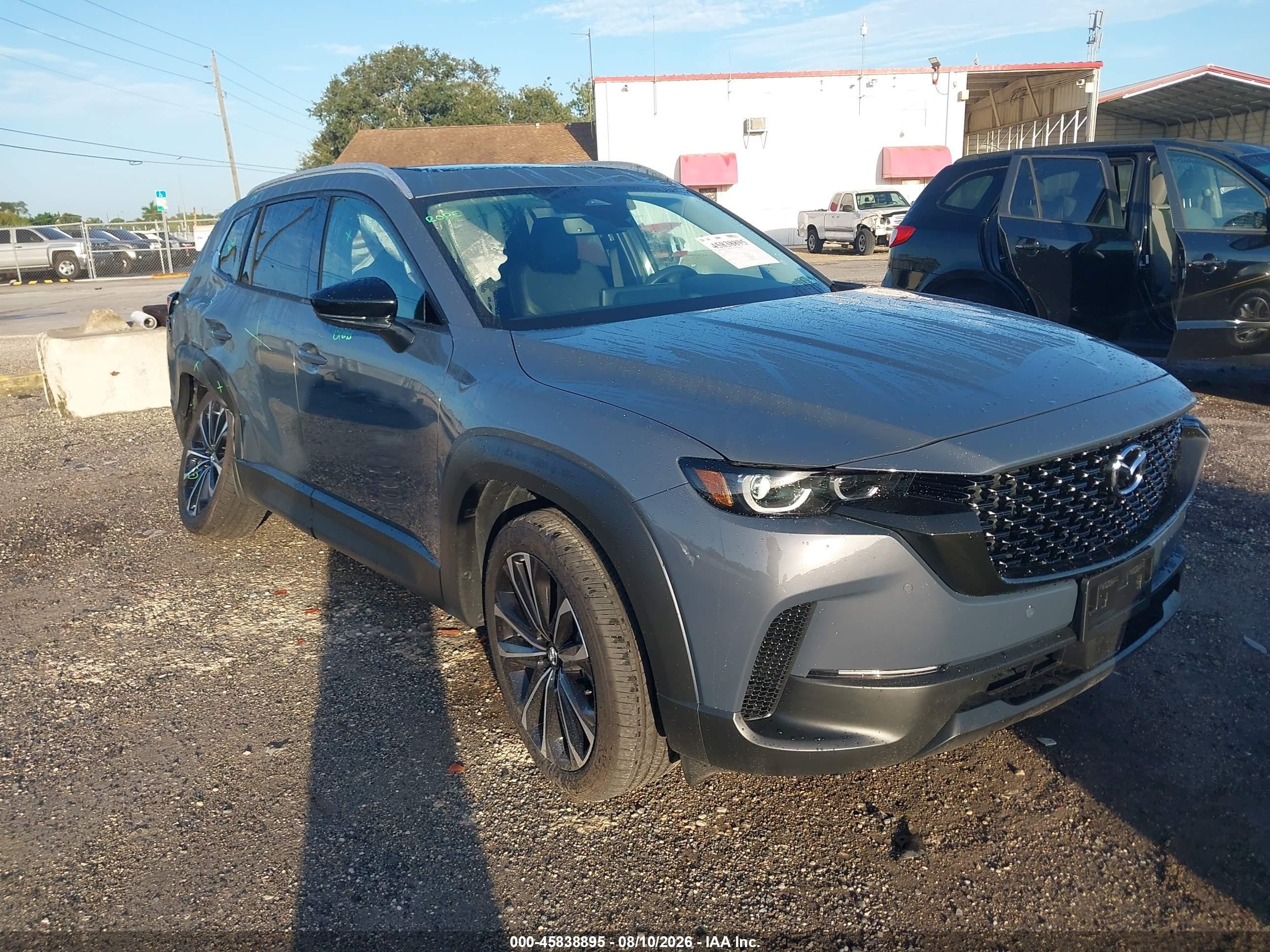 2026 Mazda CX-50 VIN 7MMVABDL7TN483934 IAAI salvage auction — Side, Rebuildable (Florida), sold $8,300 on 2026-09-11 (photo 1)