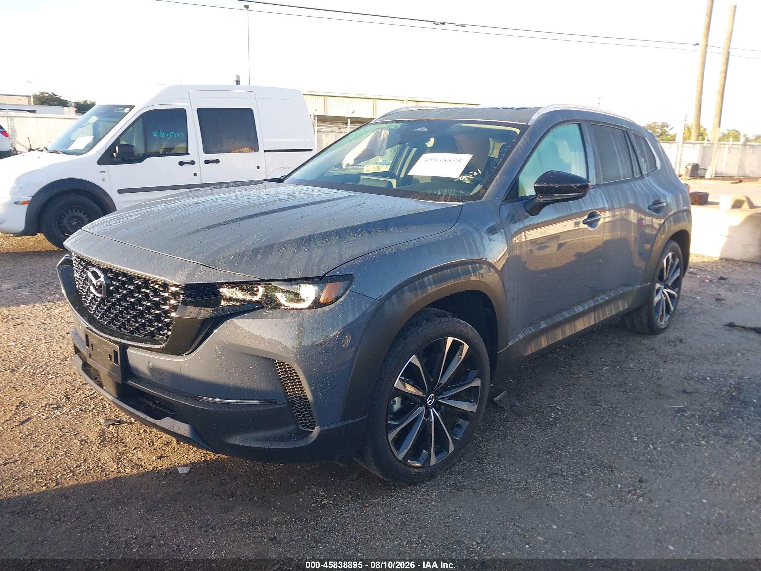 2026 Mazda CX-50 VIN 7MMVABDL7TN483934 IAAI salvage auction — Side, Rebuildable (Florida), sold $8,300 on 2026-09-11 (photo 2)