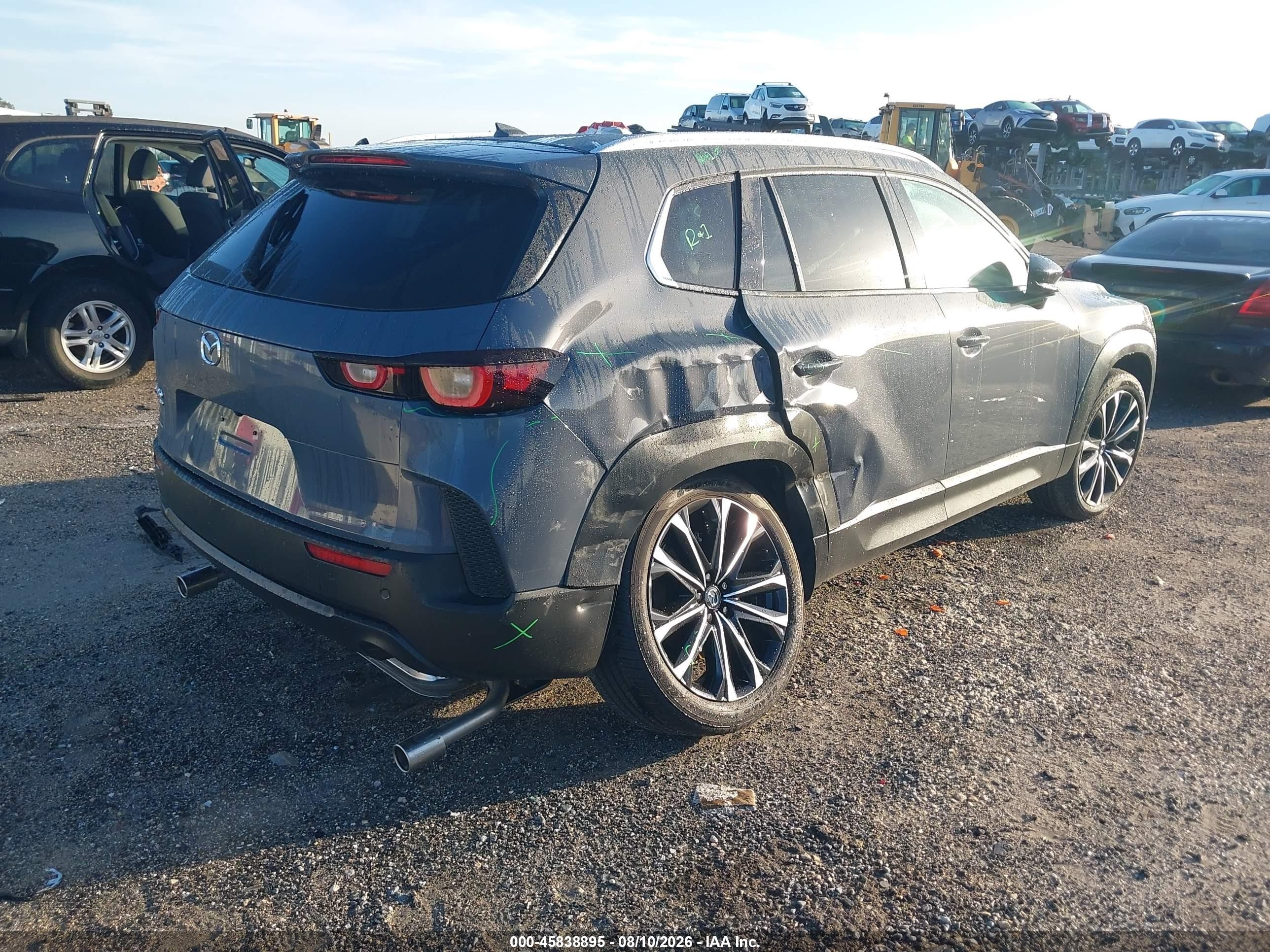 2026 Mazda CX-50 VIN 7MMVABDL7TN483934 IAAI salvage auction — Side, Rebuildable (Florida), sold $8,300 on 2026-09-11 (photo 4)