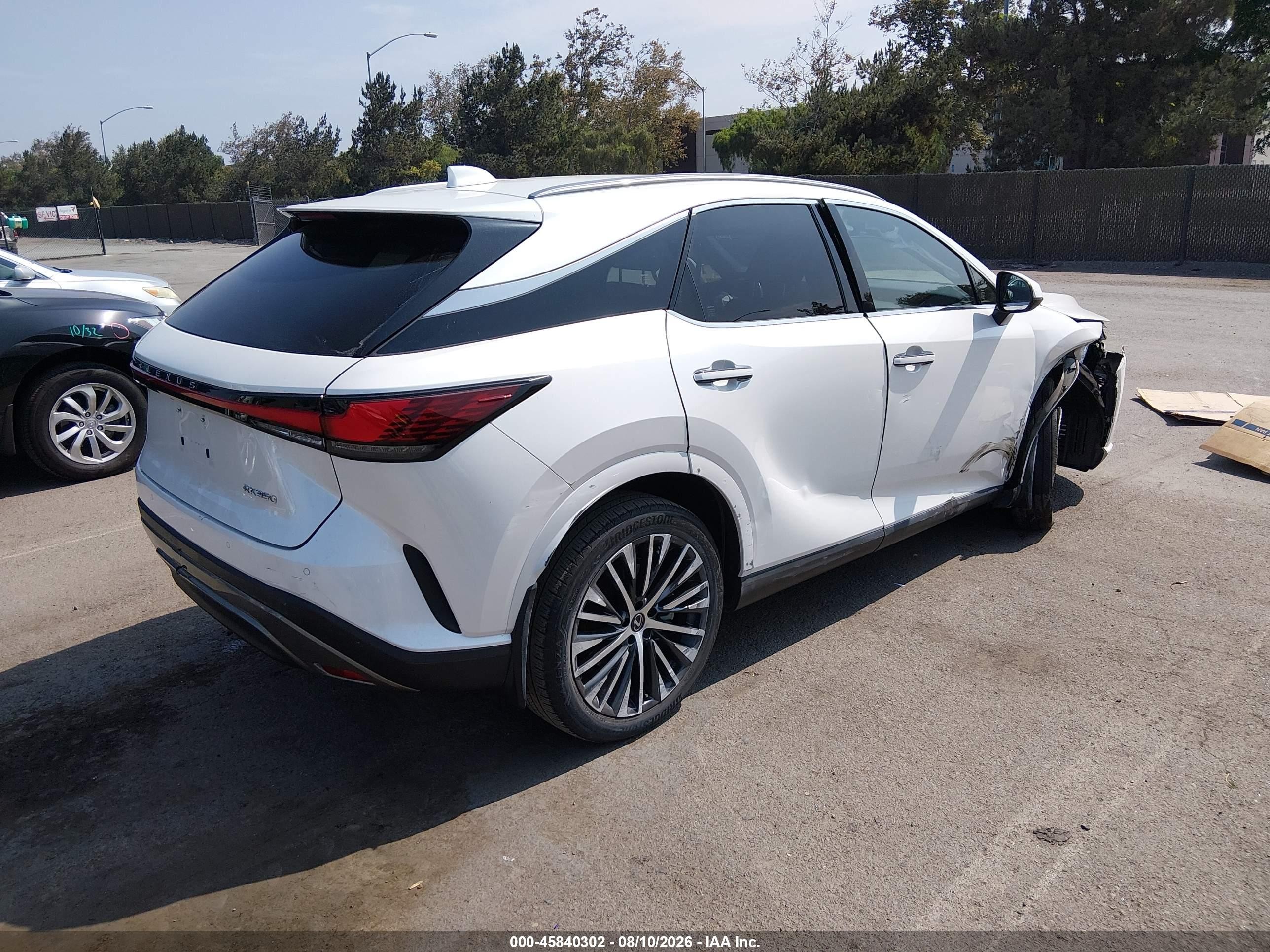 2023 Lexus Rx VIN JTJCHMAA8P2004586 IAAI salvage auction — Unknown, Salvage (California), sold $20,100 on 2026-08-24 (photo 4)