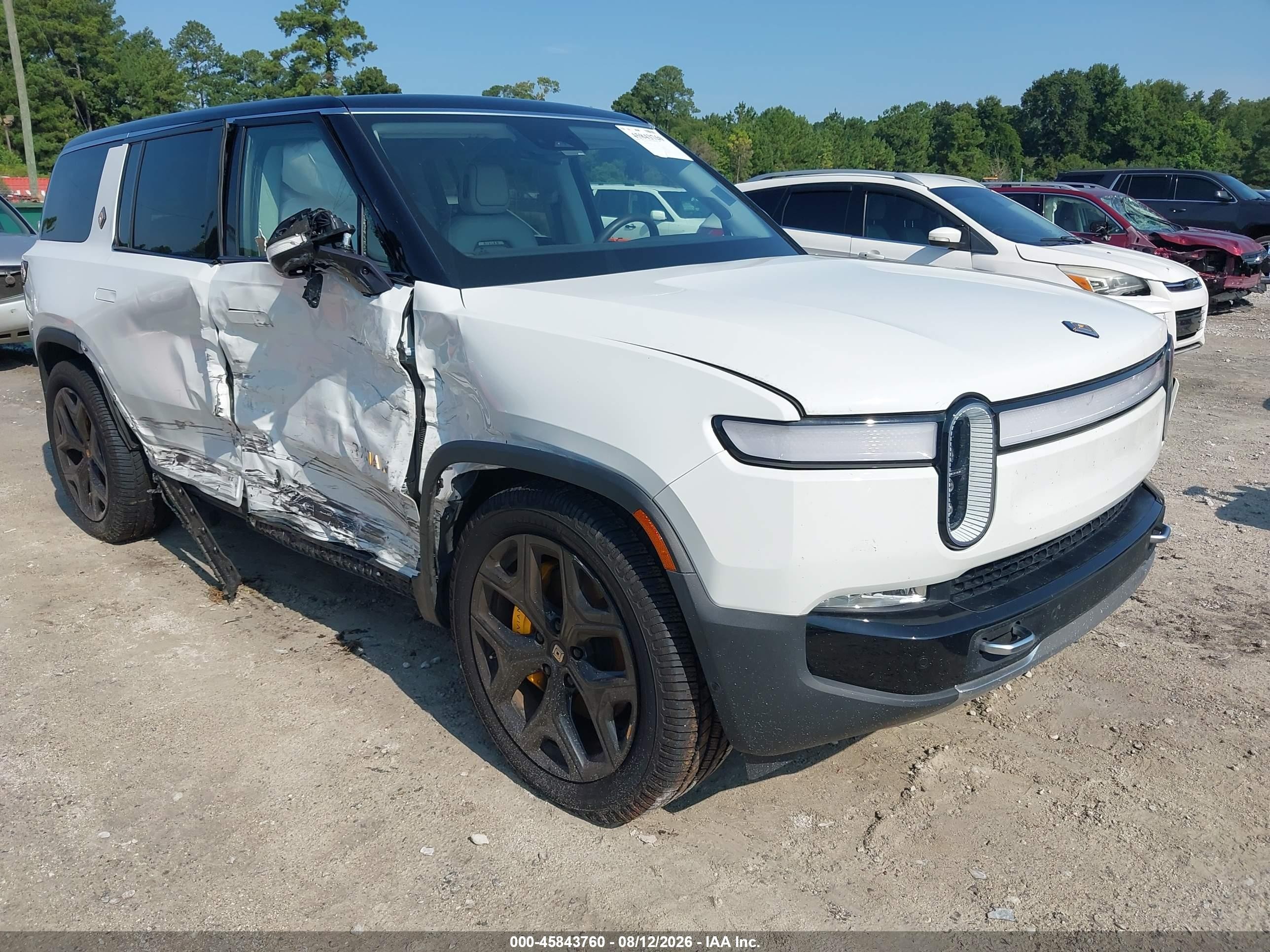 2023 Rivian R1S VIN 7PDSGABA9PN010385 — IAAI salvage auction photo