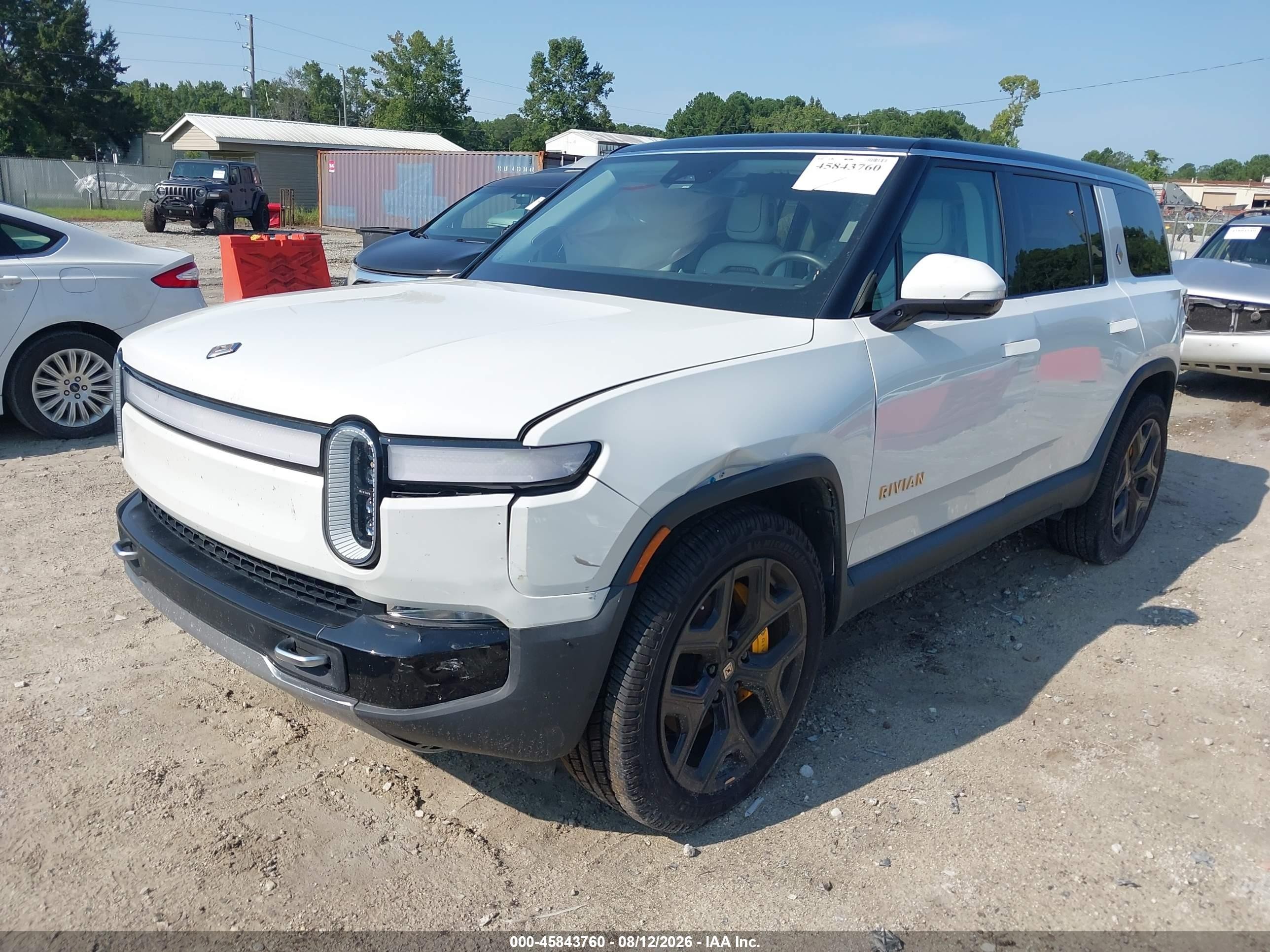2023 Rivian R1s VIN 7PDSGABA9PN010385 IAAI salvage auction — Side, Salvage (North Carolina), sold $18,000 on 2026-09-29 (photo 2)