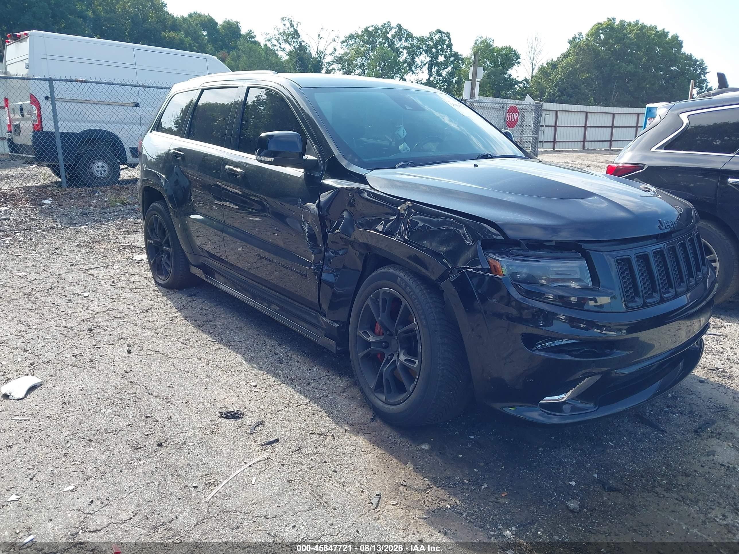 2014 Jeep Grand Cherokee VIN 1C4RJFDJ4EC160950 — IAAI salvage auction photo