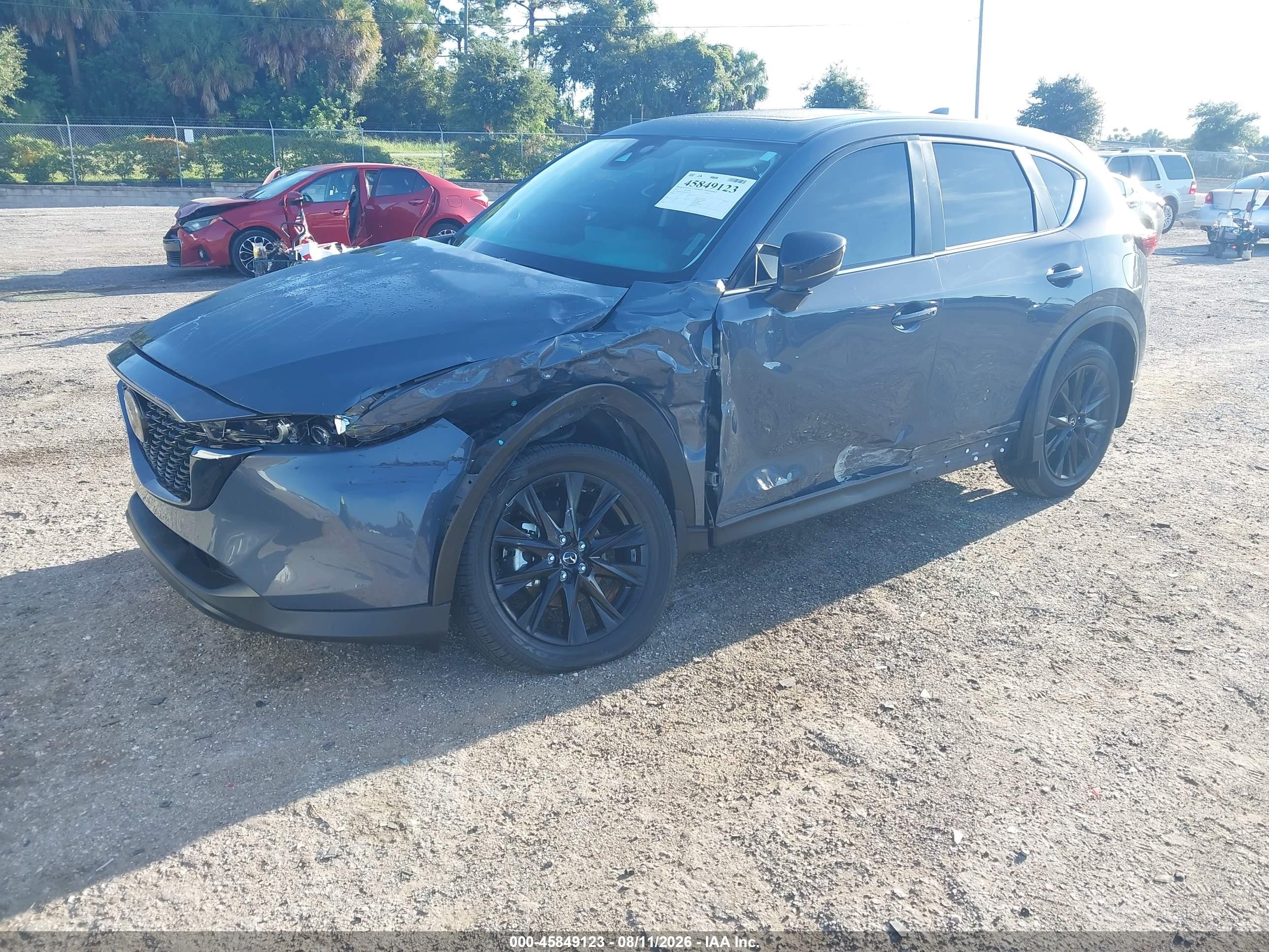 2023 Mazda Cx-5 VIN JM3KFBCM2P0215625 IAAI salvage auction — Side, Certificate Of Destruction (Florida), sold $7,850 on 2026-09-03 (photo 2)