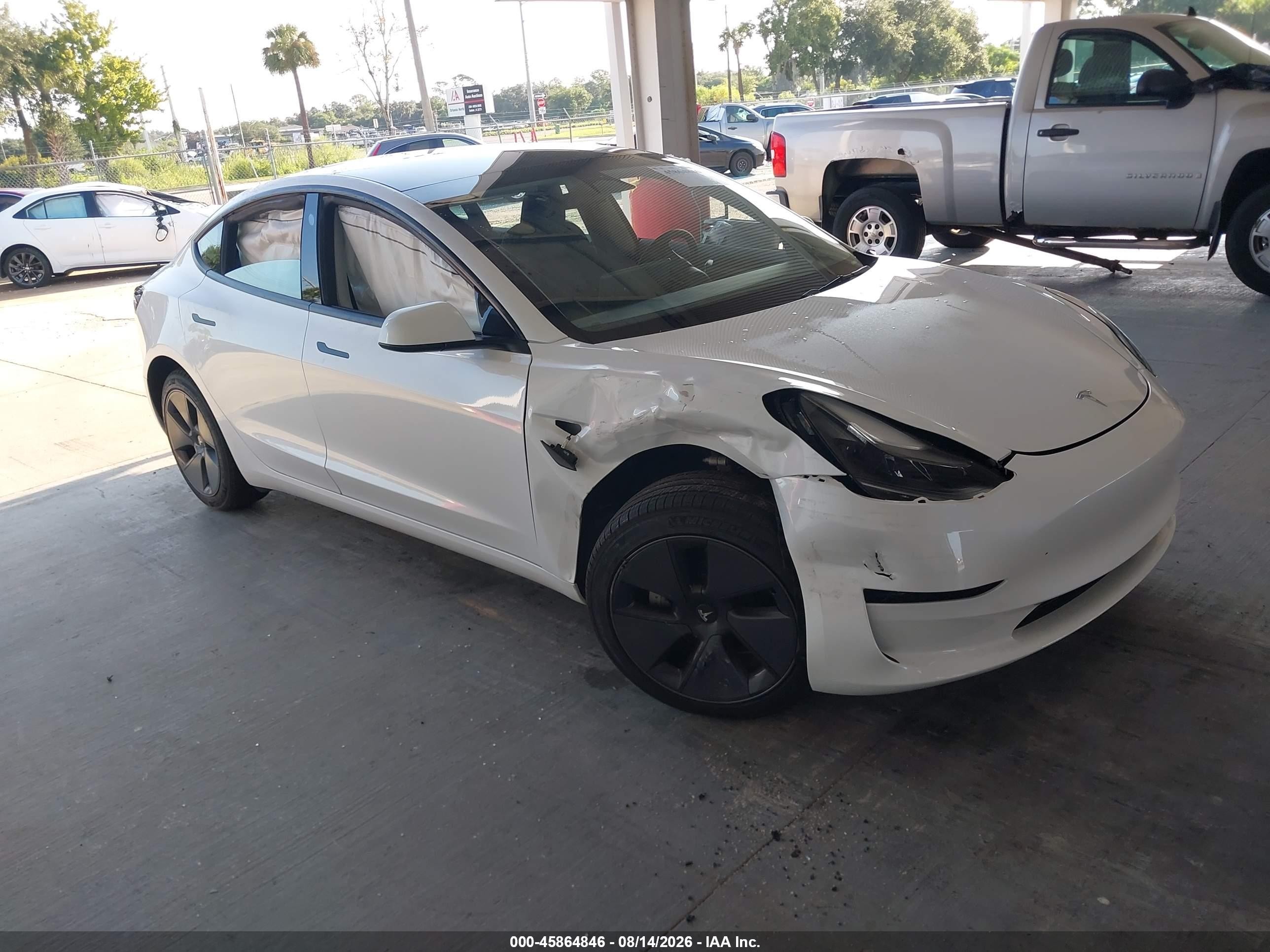 2023 Tesla Model 3 VIN 5YJ3E1EA5PF569251 — IAAI salvage auction photo