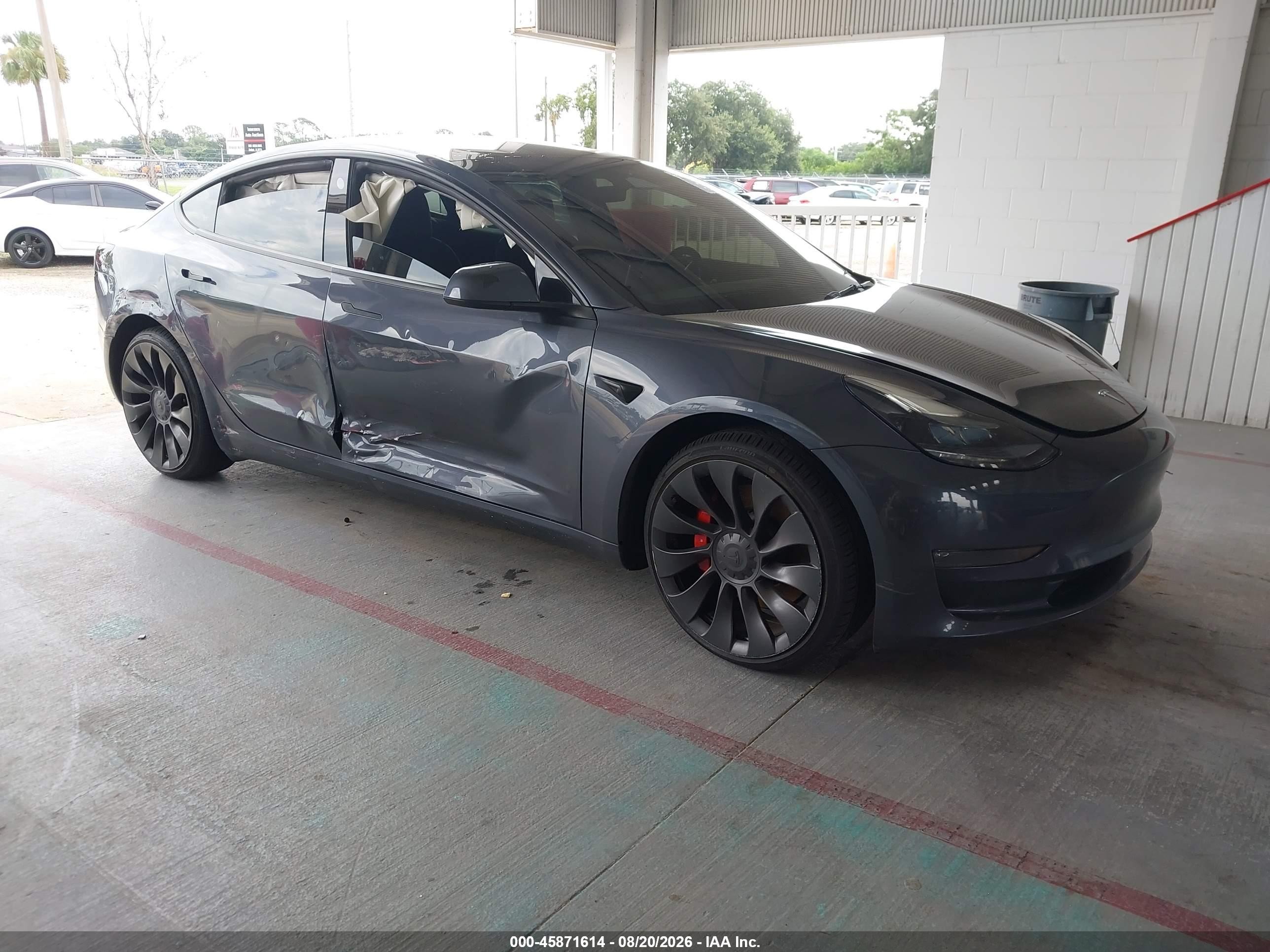 2023 Tesla Model 3 VIN 5YJ3E1EC4PF518938 — IAAI salvage auction photo