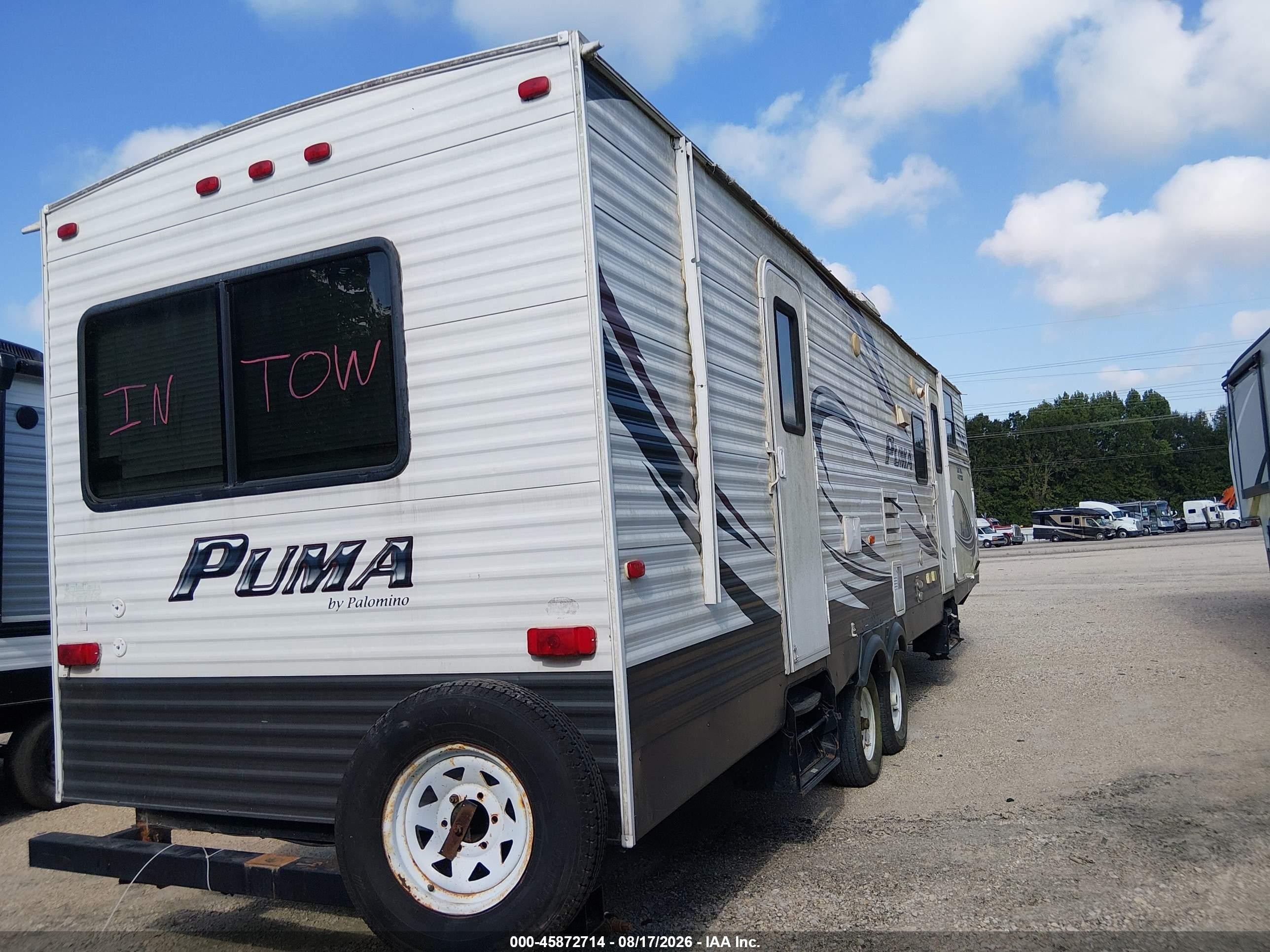 2014 Palomino Puma VIN 4X4TPUF28EP049898 IAAI salvage auction — Storm Damage, Certificate Of Destruction (Louisiana), sold $800 on 2026-09-18 (photo 4)
