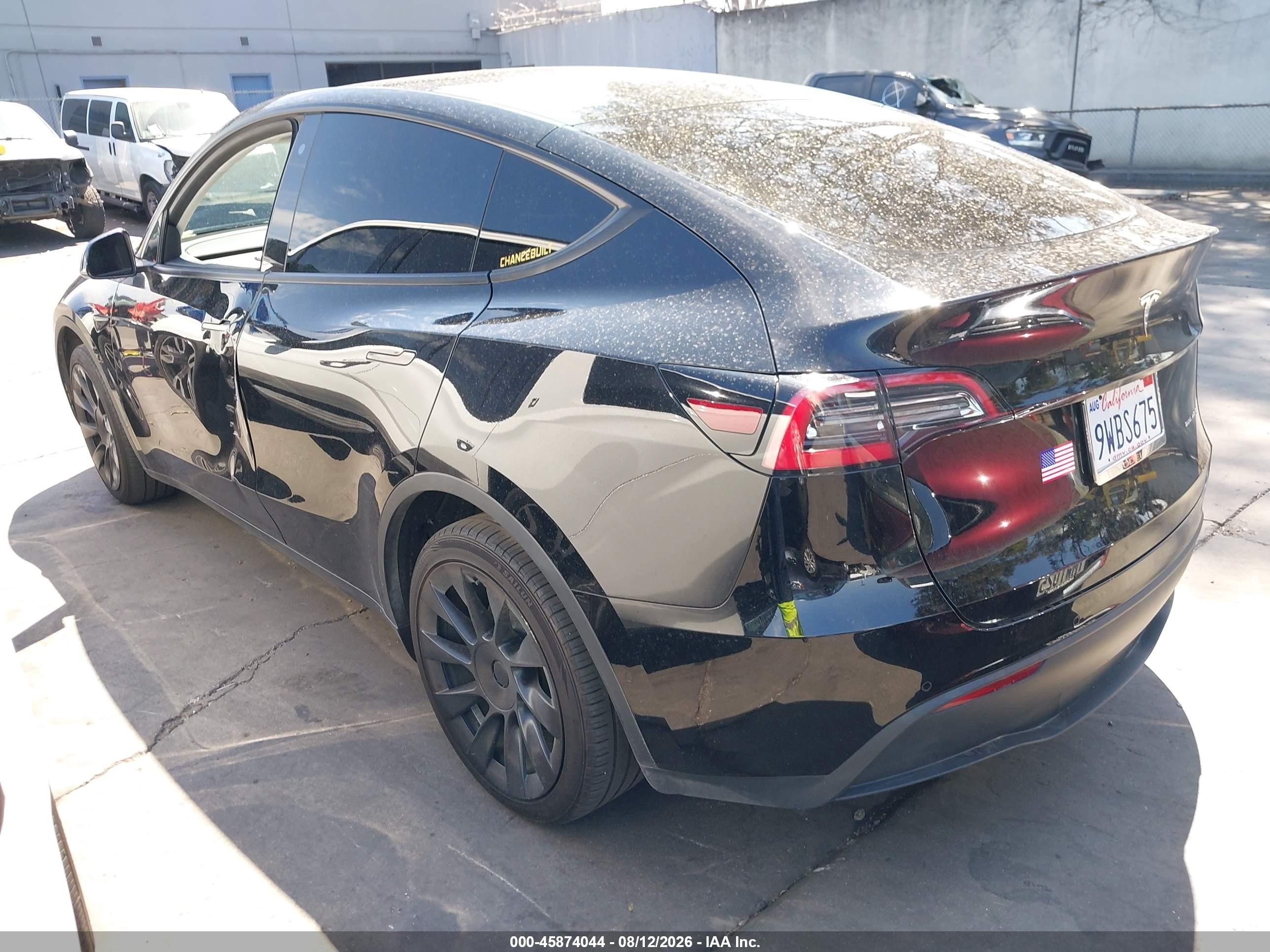 2020 Tesla Model Y VIN 5YJYGDEE4LF038976 IAAI salvage auction — Side, Salvage Certificate (California), sold $8,500 on 2026-09-12 (photo 3)