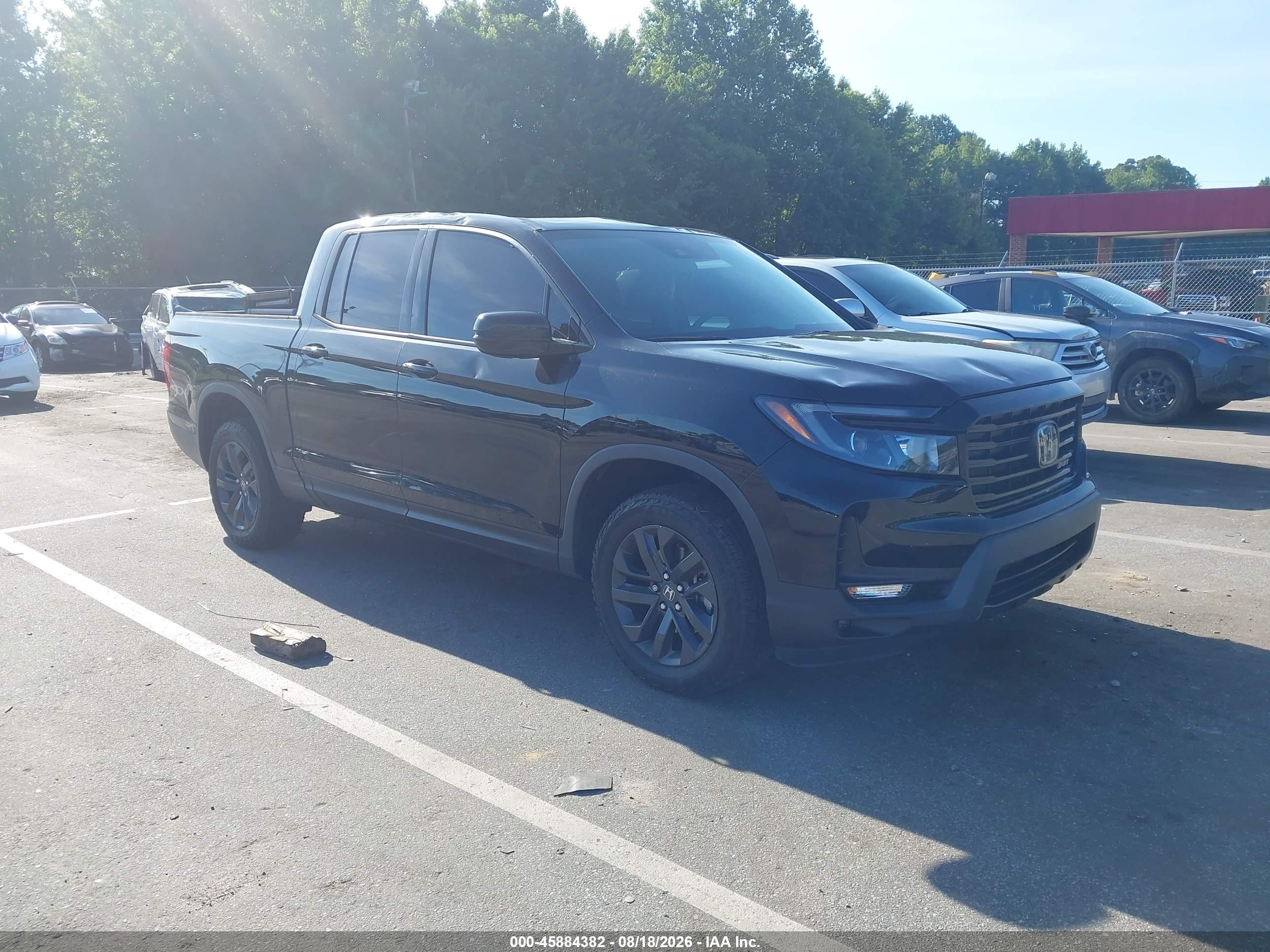 2023 Honda Ridgeline VIN 5FPYK3F15PB049177 — IAAI salvage auction photo