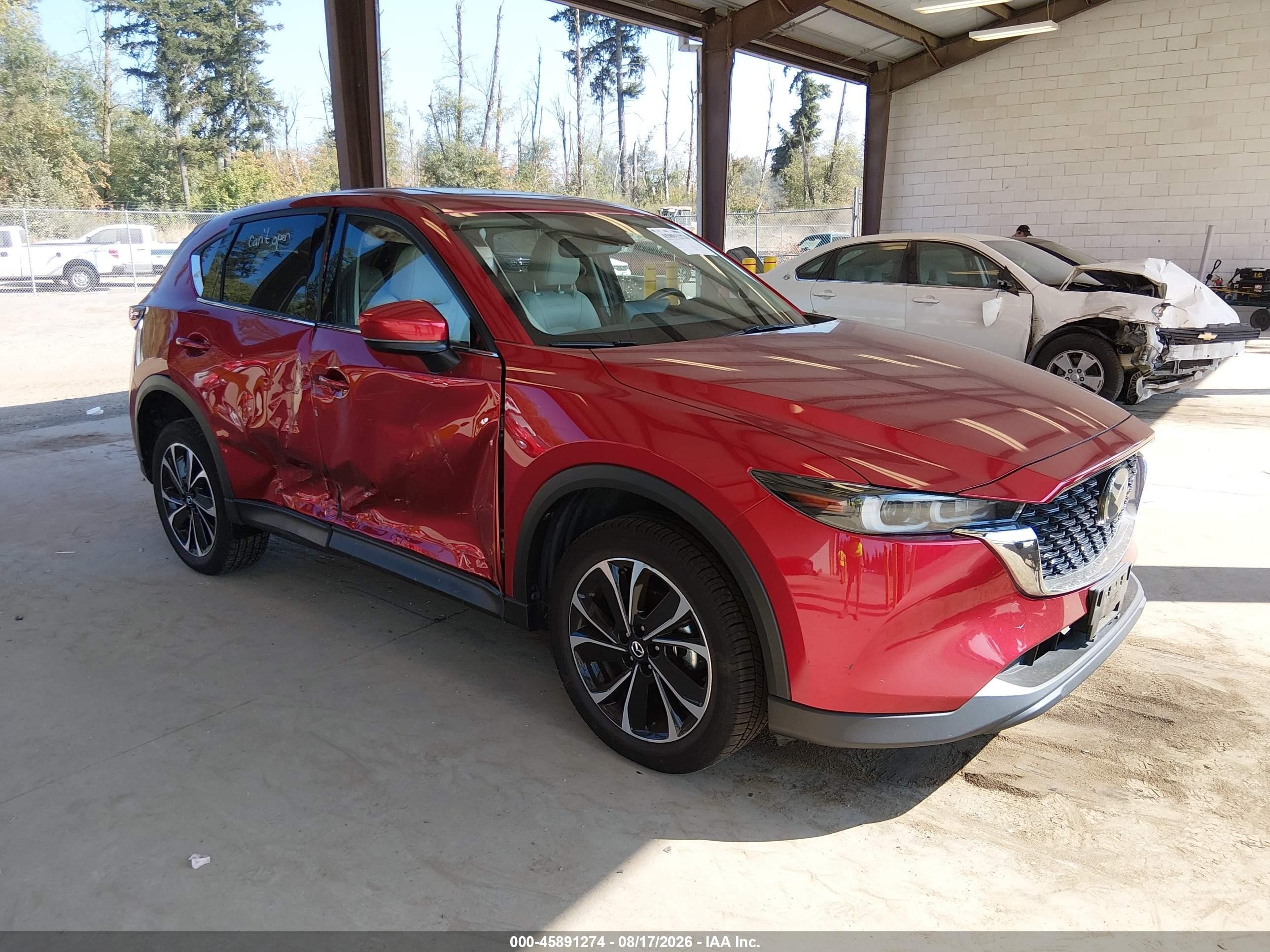 2023 Mazda CX-5 VIN JM3KFBEM8P0130625 — IAAI salvage auction photo