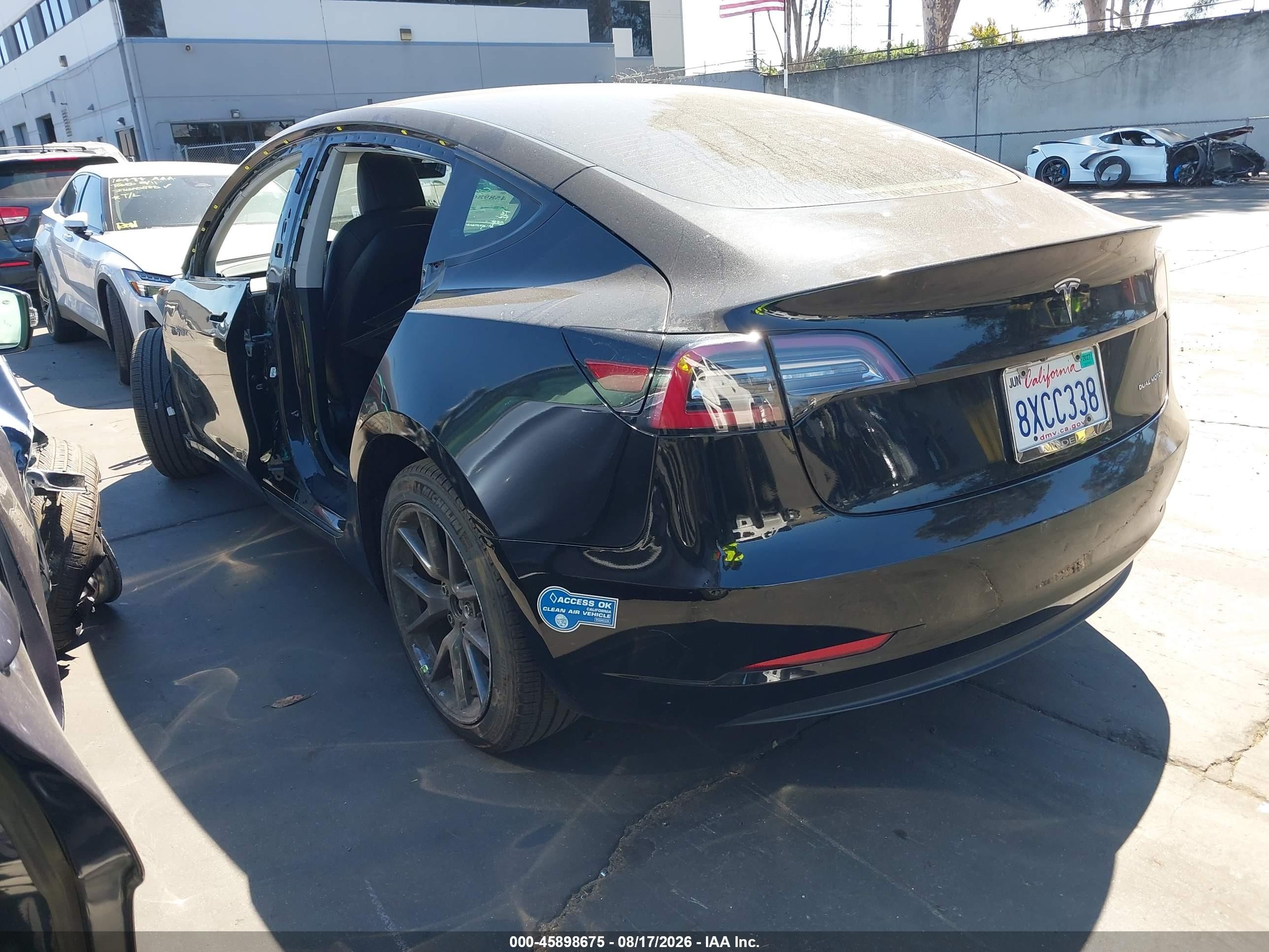 2021 Tesla Model 3 VIN 5YJ3E1EB7MF002429 IAAI salvage auction — Side, Salvage Certificate (California), sold $7,600 on 2026-09-19 (photo 3)