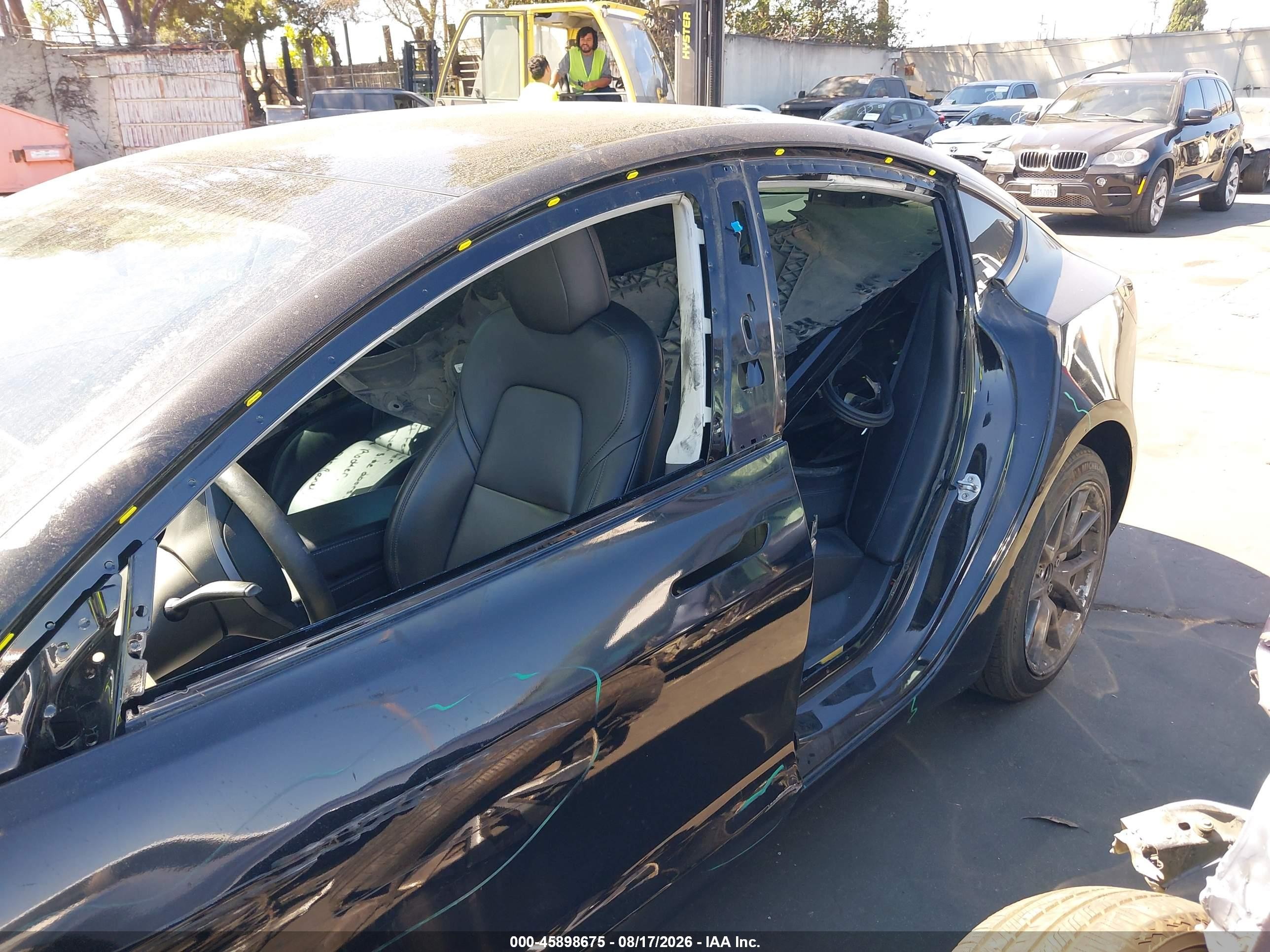 2021 Tesla Model 3 VIN 5YJ3E1EB7MF002429 IAAI salvage auction — Side, Salvage Certificate (California), sold $7,600 on 2026-09-19 (photo 6)