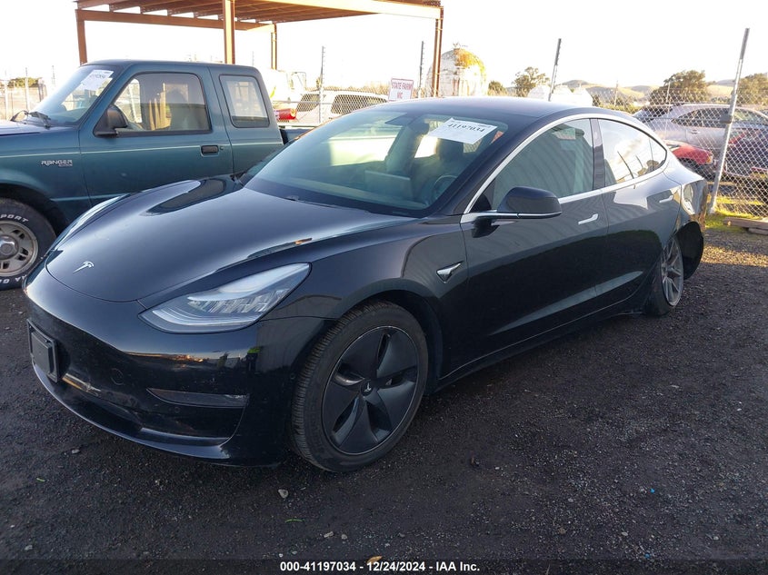 2018 Tesla Model 3 VIN 5YJ3E1EB1JF144433 COPART salvage auction — Left Rear, Salvage (California), sold $9,500 on 2025-01-30 (photo 2)