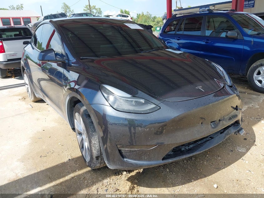 2024 Tesla Model Y VIN 7SAYGDED6RF054342 IAAI salvage auction — Side, Rebuildable (Florida), sold $14,500 on 2026-05-22 (photo 1)