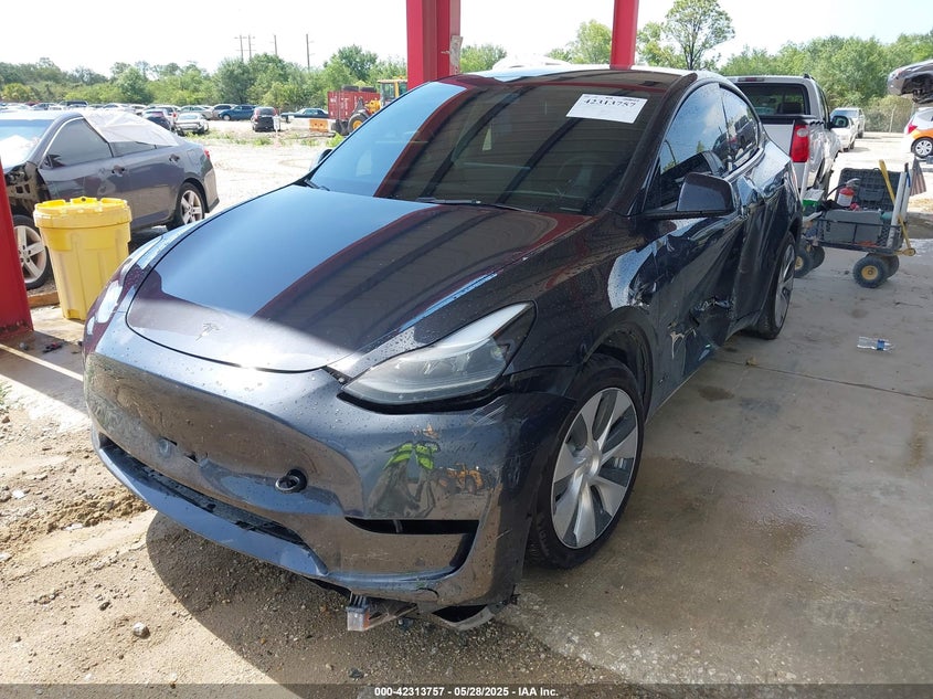 2024 Tesla Model Y VIN 7SAYGDED6RF054342 IAAI salvage auction — Side, Rebuildable (Florida), sold $14,500 on 2026-05-22 (photo 2)