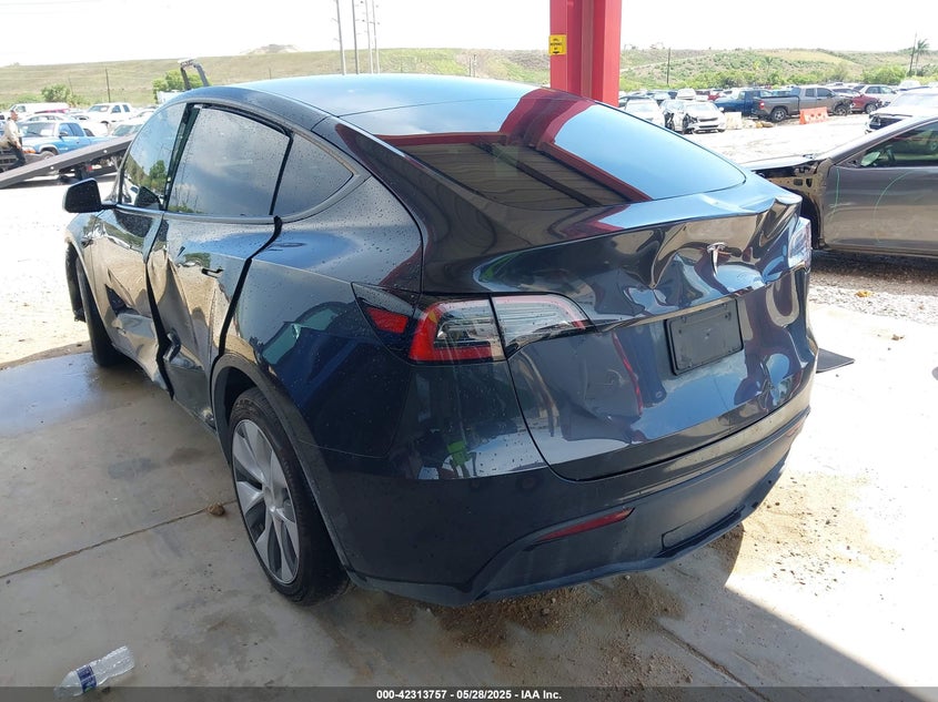 2024 Tesla Model Y VIN 7SAYGDED6RF054342 IAAI salvage auction — Side, Rebuildable (Florida), sold $14,500 on 2026-05-22 (photo 3)