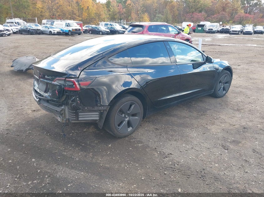2023 Tesla Model 3 VIN 5YJ3E1EA9PF577918 IAAI salvage auction — REAR END, Other, sold $7,900 on 2026-07-15 (photo 4)
