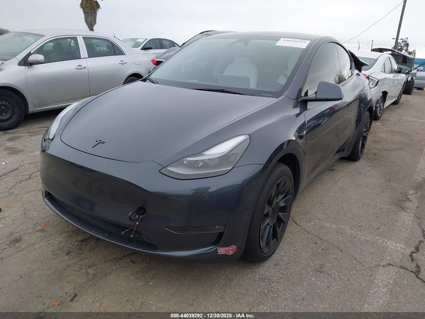 2023 Tesla Model y VIN 7SAYGDEE9PF960362 IAAI salvage auction — RIGHT SIDE, Salvage (California), sold $12,450 on 2026-09-03 (photo 2)