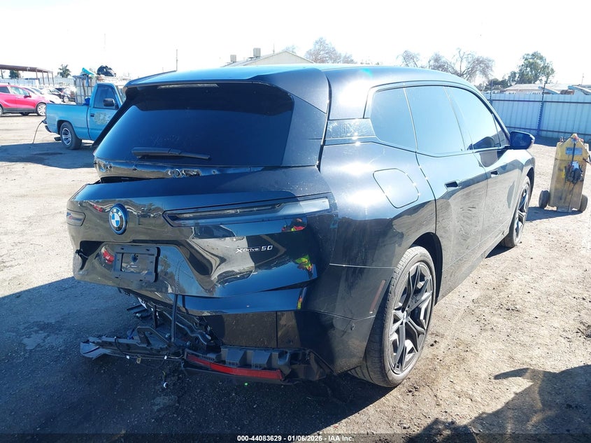 2025 BMW Ix VIN WB523CF03SCT07734 IAAI salvage auction — REAR END, Salvage (California), sold $12,600 on 2026-07-30 (photo 4)