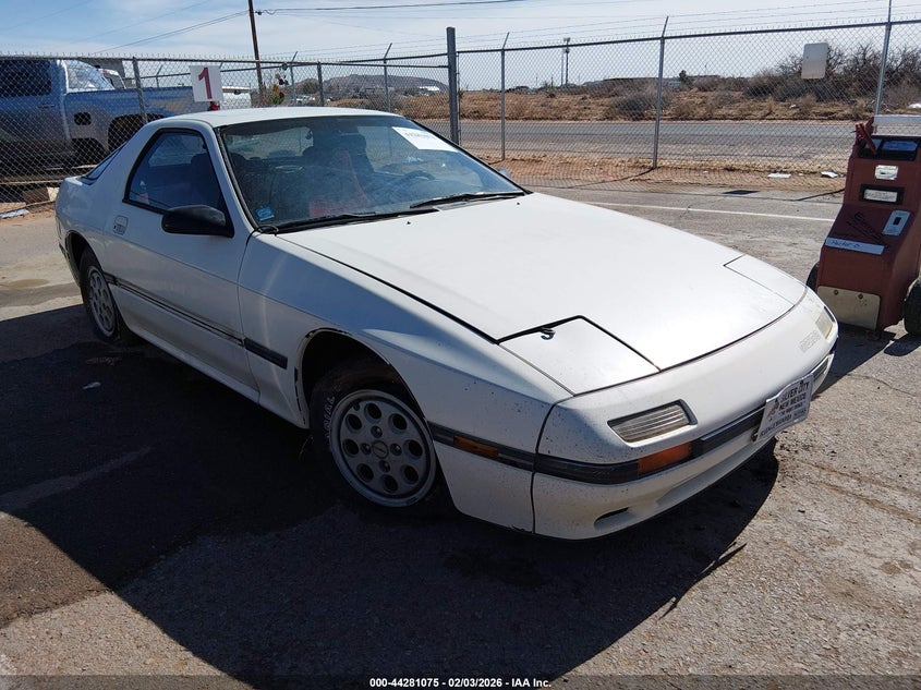 1986 Mazda Rx-7 VIN JM1FC3317G0147403 IAAI salvage auction — LEFT REAR, Clear (New Mexico), sold $75 on 2026-07-29 (photo 1)