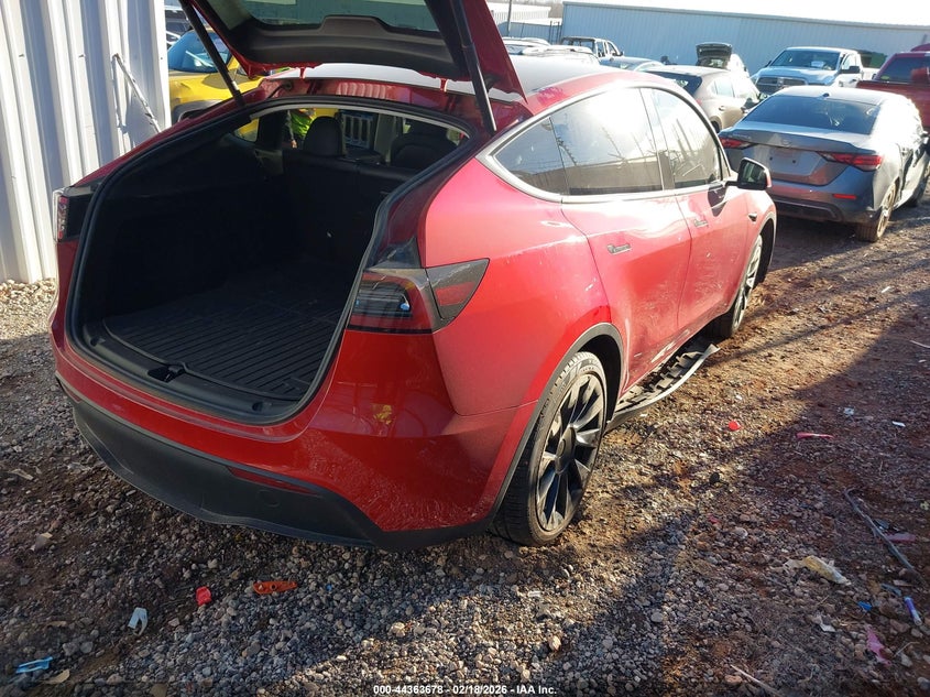 2023 Tesla Model y VIN 7SAYGDEE0PA051603 IAAI salvage auction — SIDE, Clear (Oklahoma), sold $14,300 on 2026-08-22 (photo 4)