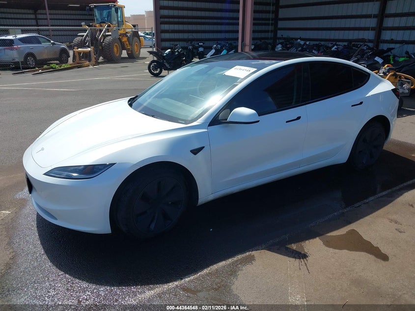 2025 Tesla Model 3 VIN 5YJ3E1EA0SF981943 IAAI salvage auction — RIGHT FRONT, Salvage (Hawaii), sold $12,900 on 2026-08-25 (photo 2)