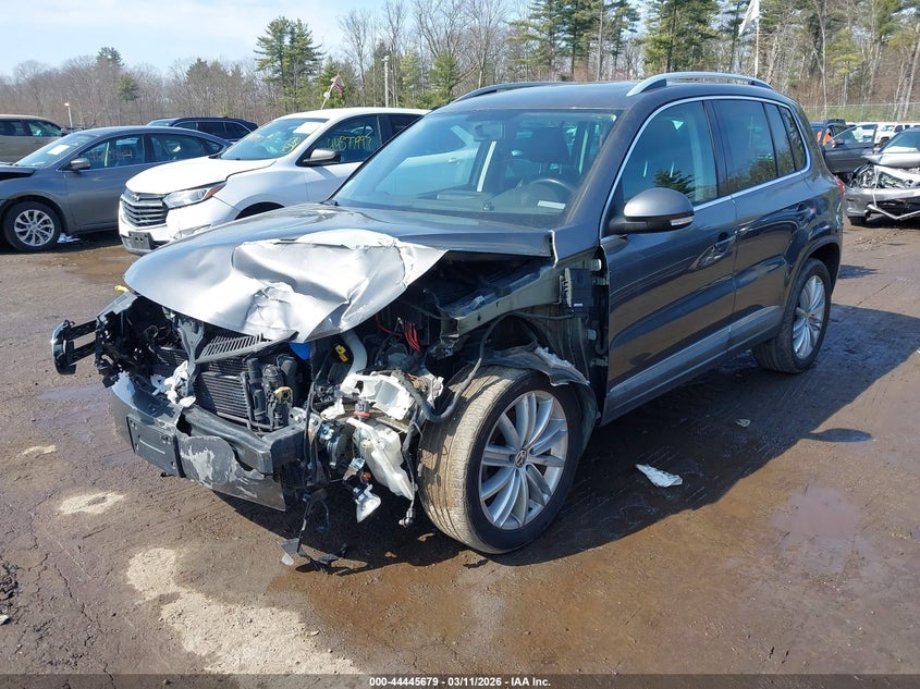 2014 Volkswagen Tiguan VIN WVGAV3AXXEW605162 IAAI salvage auction — LEFT FRONT, Salvage Title, sold $1,050 on 2026-07-10 (photo 2)