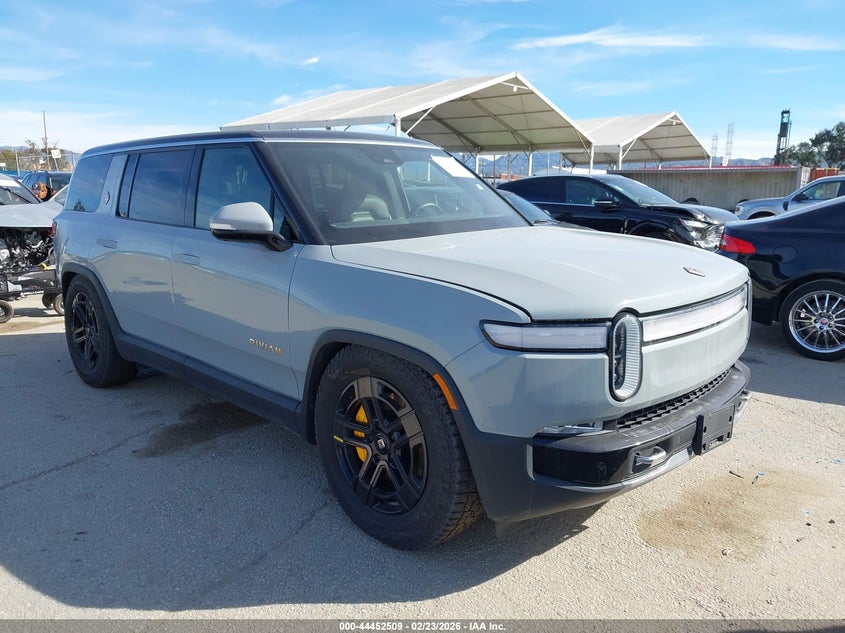 2023 Rivian R1s VIN 7PDSGABA0PN019590 IAAI salvage auction — Side, Salvage (California), sold $23,800 on 2026-04-01 (photo 1)