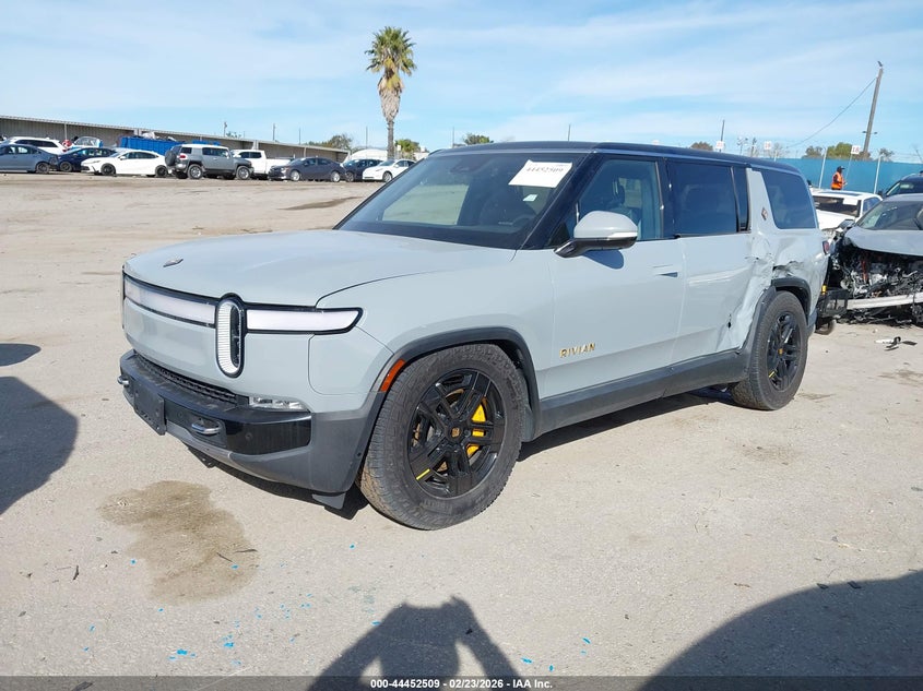 2023 Rivian R1s VIN 7PDSGABA0PN019590 IAAI salvage auction — Side, Salvage (California), sold $23,800 on 2026-04-01 (photo 2)
