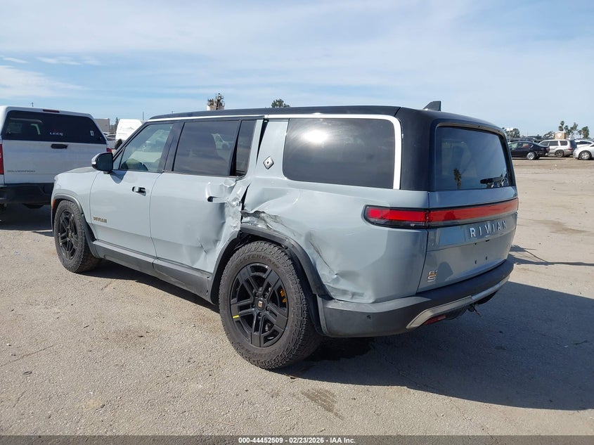 2023 Rivian R1s VIN 7PDSGABA0PN019590 IAAI salvage auction — Side, Salvage (California), sold $23,800 on 2026-04-01 (photo 3)