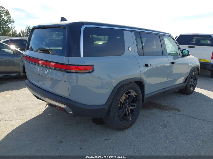 2023 Rivian R1s VIN 7PDSGABA0PN019590 IAAI salvage auction — Side, Salvage (California), sold $23,800 on 2026-04-01 (photo 4)