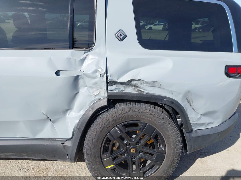2023 Rivian R1s VIN 7PDSGABA0PN019590 IAAI salvage auction — Side, Salvage (California), sold $23,800 on 2026-04-01 (photo 6)