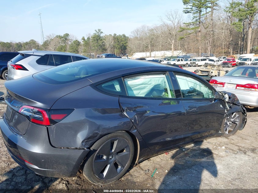 2023 Tesla Model 3 VIN 5YJ3E1EA3PF664018 IAAI salvage auction — FRONT & REAR, Salvage Title, sold $3,650 on 2026-07-09 (photo 6)