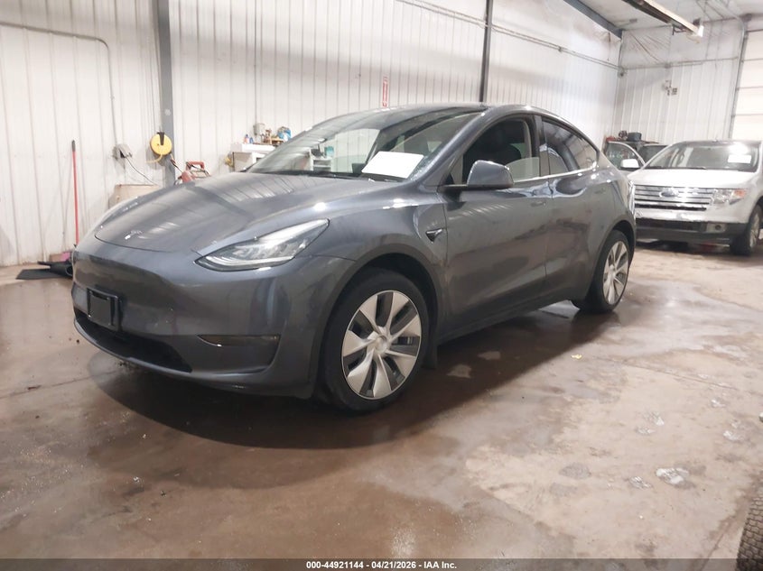 2023 Tesla Model y VIN 7SAYGDEEXPA155869 IAAI salvage auction — RIGHT SIDE, Salvage Title, sold $12,600 on 2026-07-07 (photo 2)