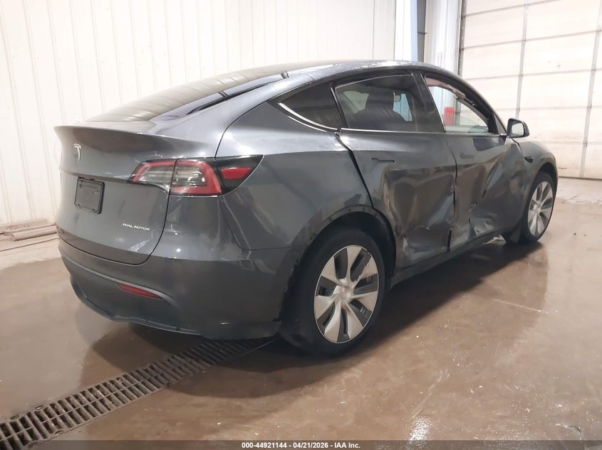 2023 Tesla Model y VIN 7SAYGDEEXPA155869 IAAI salvage auction — RIGHT SIDE, Salvage Title, sold $12,600 on 2026-07-07 (photo 4)