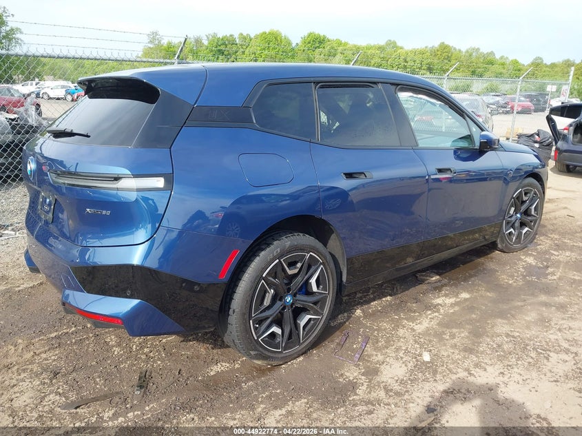 2024 BMW Ix VIN WB523CF02RCS04377 IAAI salvage auction — LEFT SIDE, Wait Title, sold $21,250 on 2026-07-27 (photo 4)