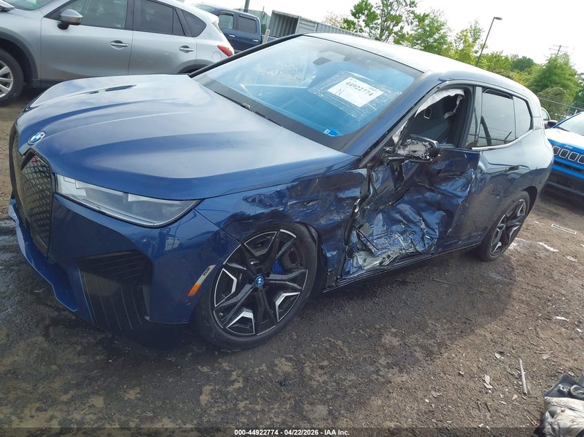 2024 BMW Ix VIN WB523CF02RCS04377 IAAI salvage auction — LEFT SIDE, Wait Title, sold $21,250 on 2026-07-27 (photo 6)