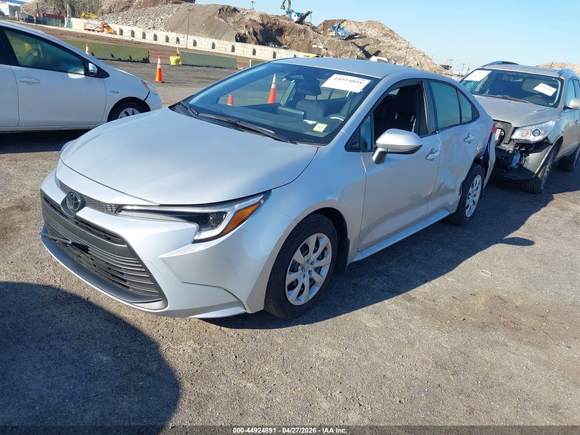 2026 Toyota Corolla VIN JTDBCMFEXT3140392 IAAI salvage auction — LEFT SIDE, Salvage Title, sold $12,975 on 2026-07-14 (photo 2)