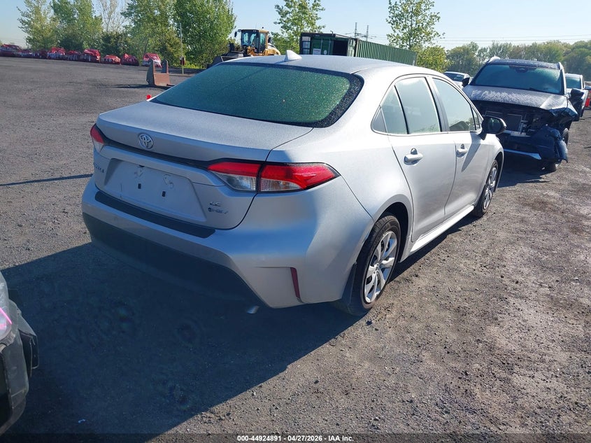 2026 Toyota Corolla VIN JTDBCMFEXT3140392 IAAI salvage auction — LEFT SIDE, Salvage Title, sold $12,975 on 2026-07-14 (photo 4)