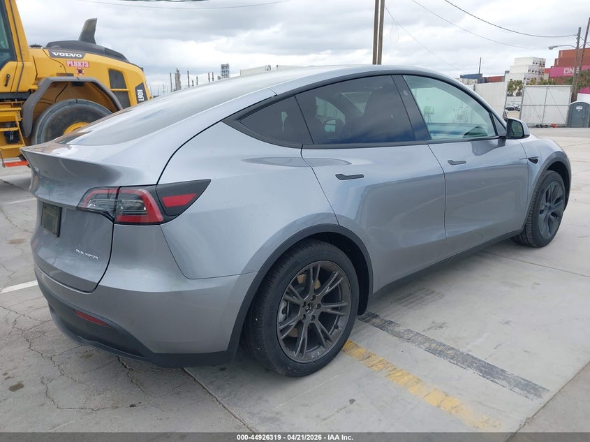 2024 Tesla Model y VIN 7SAYGDEE8RA310793 IAAI salvage auction — LEFT SIDE, Salvage Title, sold $12,300 on 2026-07-08 (photo 4)